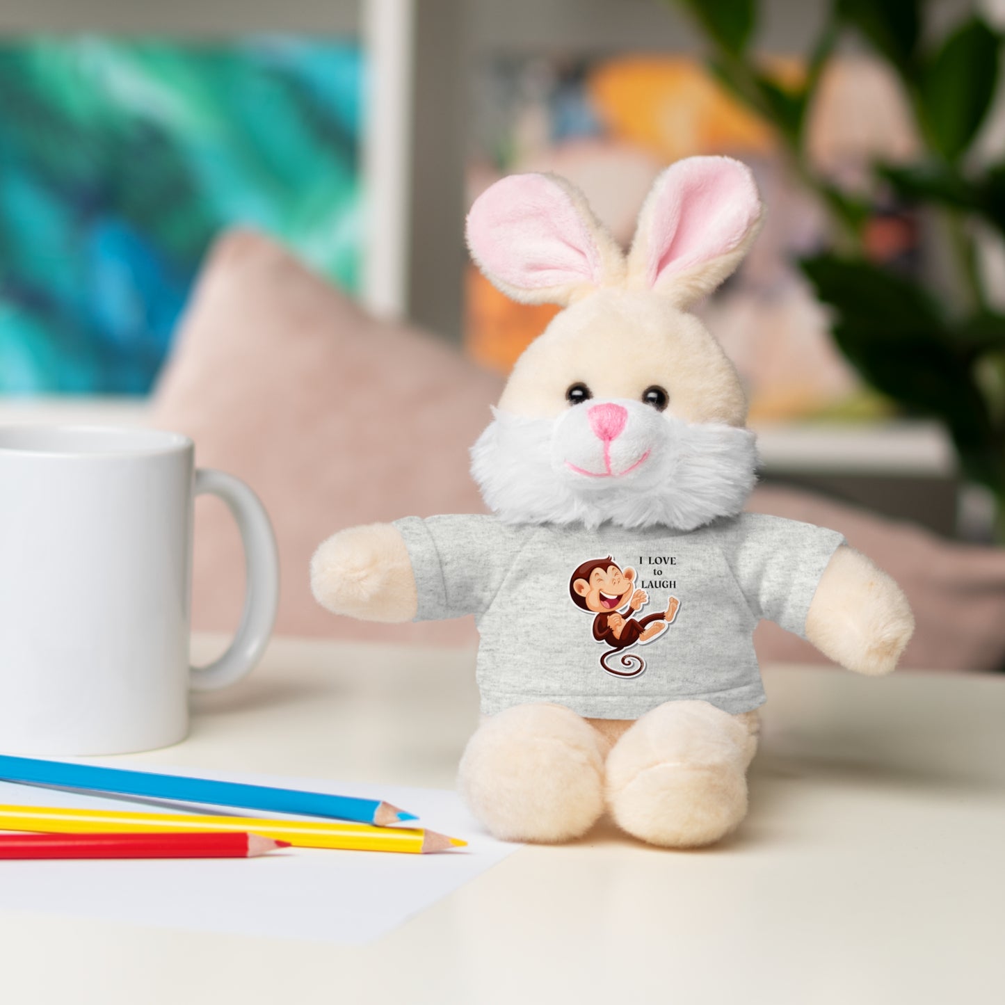 Plush bunny toy with removable I Love to Laugh monkey shirt, part of Cool Stuff Stuffies collection, ideal for kids' play and snuggling.