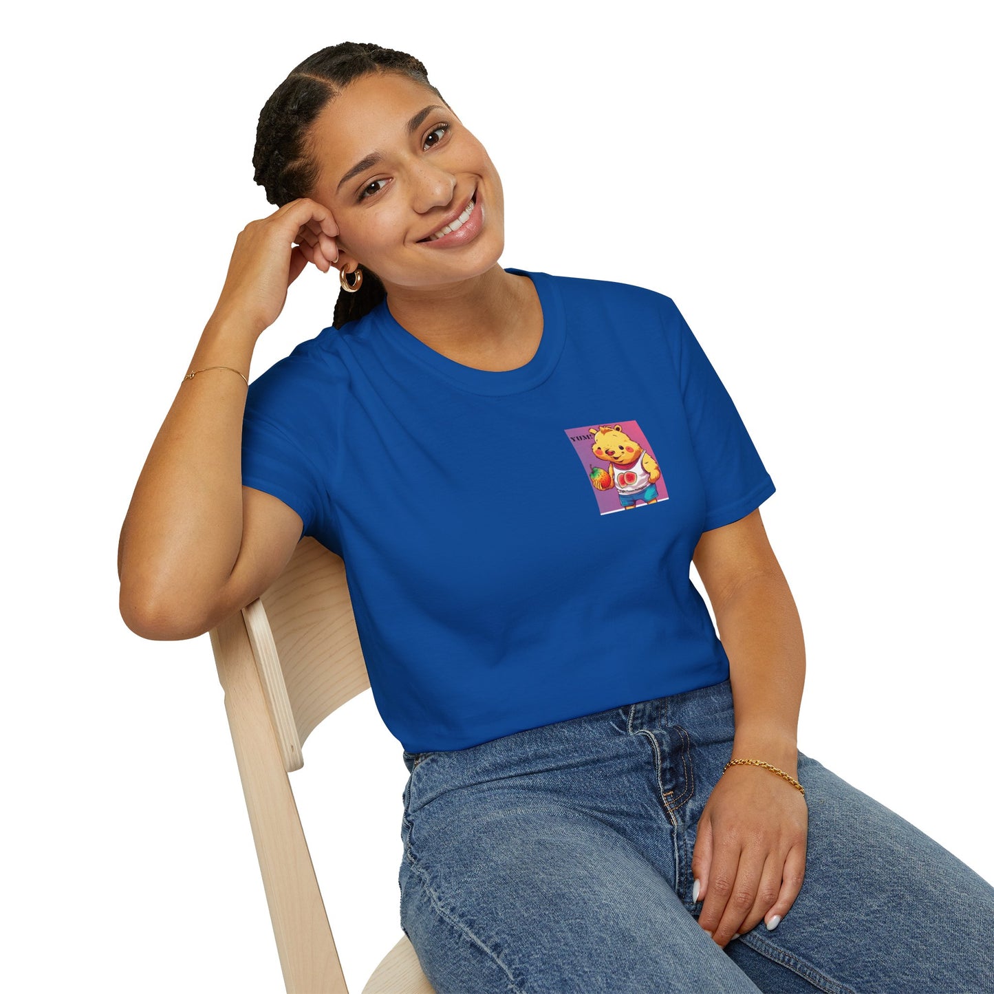 A woman in a blue shirt sits on a chair, showcasing the Yum Strawberries Unisex T-Shirt's comfort and style. Made of soft 100% cotton, featuring twill tape shoulders for durability and a ribbed collar.