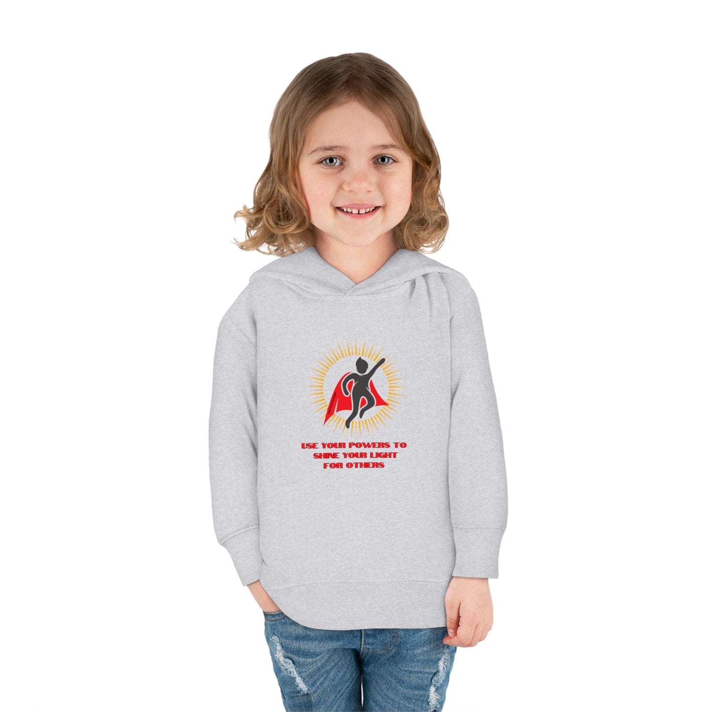 A smiling girl in a Rabbit Skins toddler hoodie with jersey-lined hood, cover-stitched details, and side seam pockets. Comfortable blend of cotton and polyester for lasting coziness.