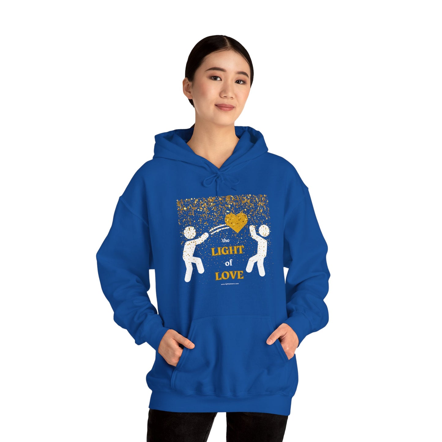 A person in a blue hoodie with a gold heart design, showcasing a cozy unisex hooded sweatshirt made of cotton and polyester blend for warmth and comfort.