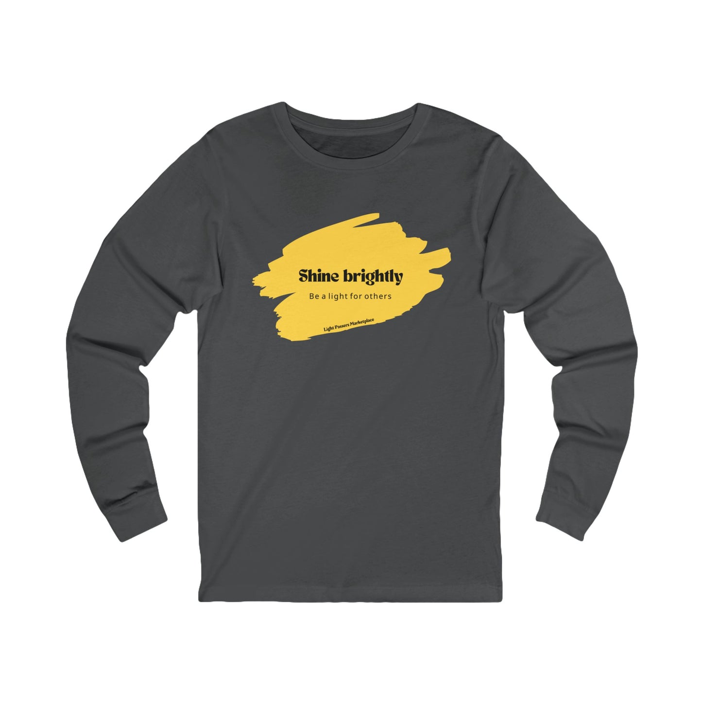 The Light Adult Unisex Long Sleeve Tee features a grey design with yellow paint and a positive message, offering structural support and shape retention.