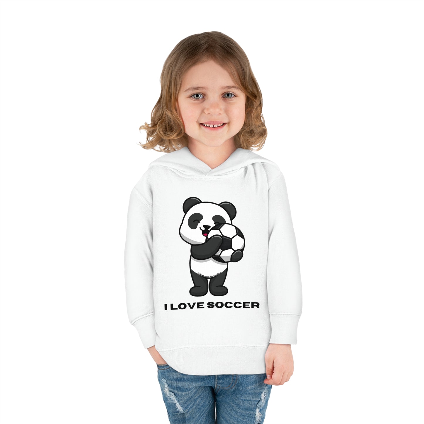 A blonde girl smiles, holding a football. A cartoon panda also holds a football. A cozy Rabbit Skins toddler hoodie with side pockets, cover-stitched details, and 60% cotton, 40% polyester blend for comfort.