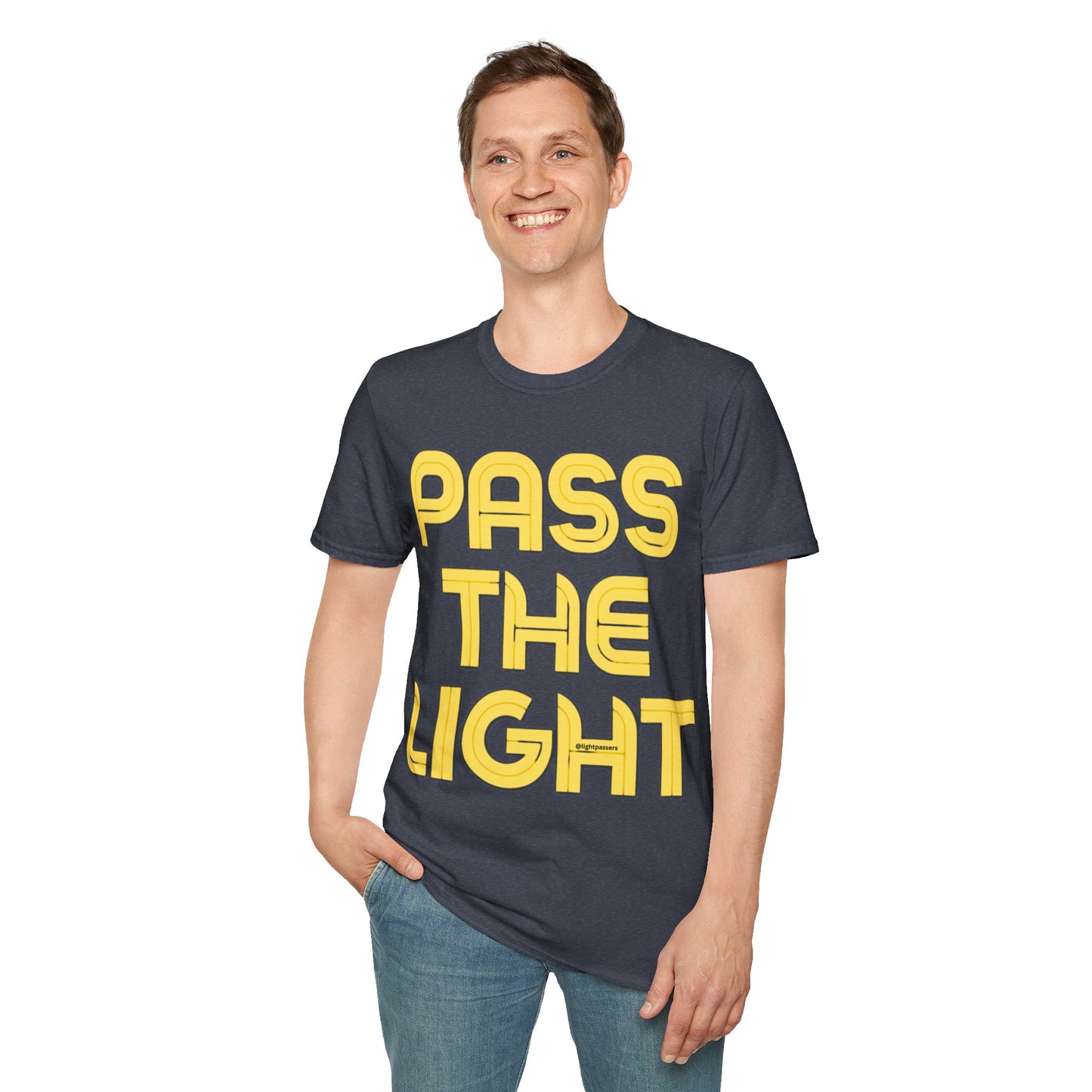 A smiling man in a PASS THE LIGHT Unisex T-shirt, featuring yellow text. Classic fit, 100% cotton tee with smooth surface for vivid printing, no side seams, and shoulder tape for durability.