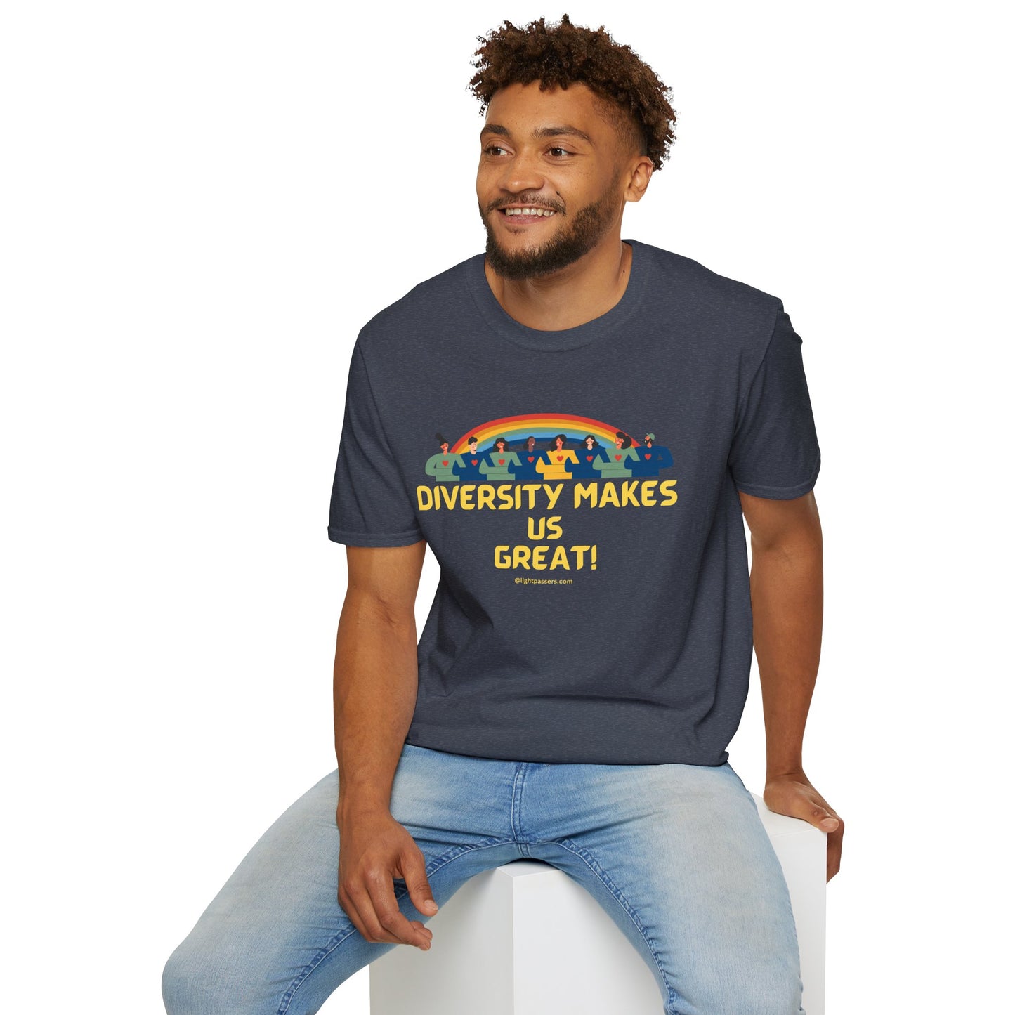 A man in jeans and a t-shirt sits on a cube. Unisex heavy cotton tee with smooth surface for vivid printing. No side seams for comfort. Shoulder tape for durability.