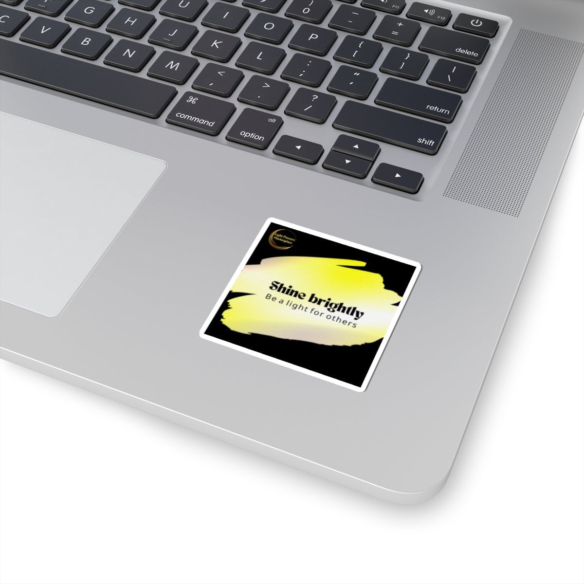 Inspirational Stickers - Put Shine Brightly for others Message Everywhere displayed on a laptop, featuring a glossy finish and vibrant design for positivity.