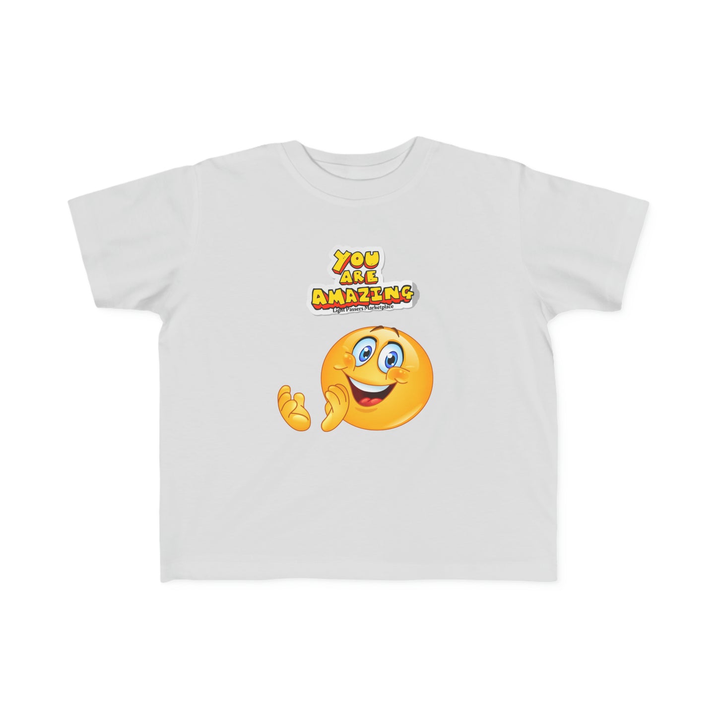 A white toddler t-shirt featuring a cartoon face design, made of soft 100% combed, ring-spun cotton. Durable print, light fabric, tear-away label, classic fit, true to size.