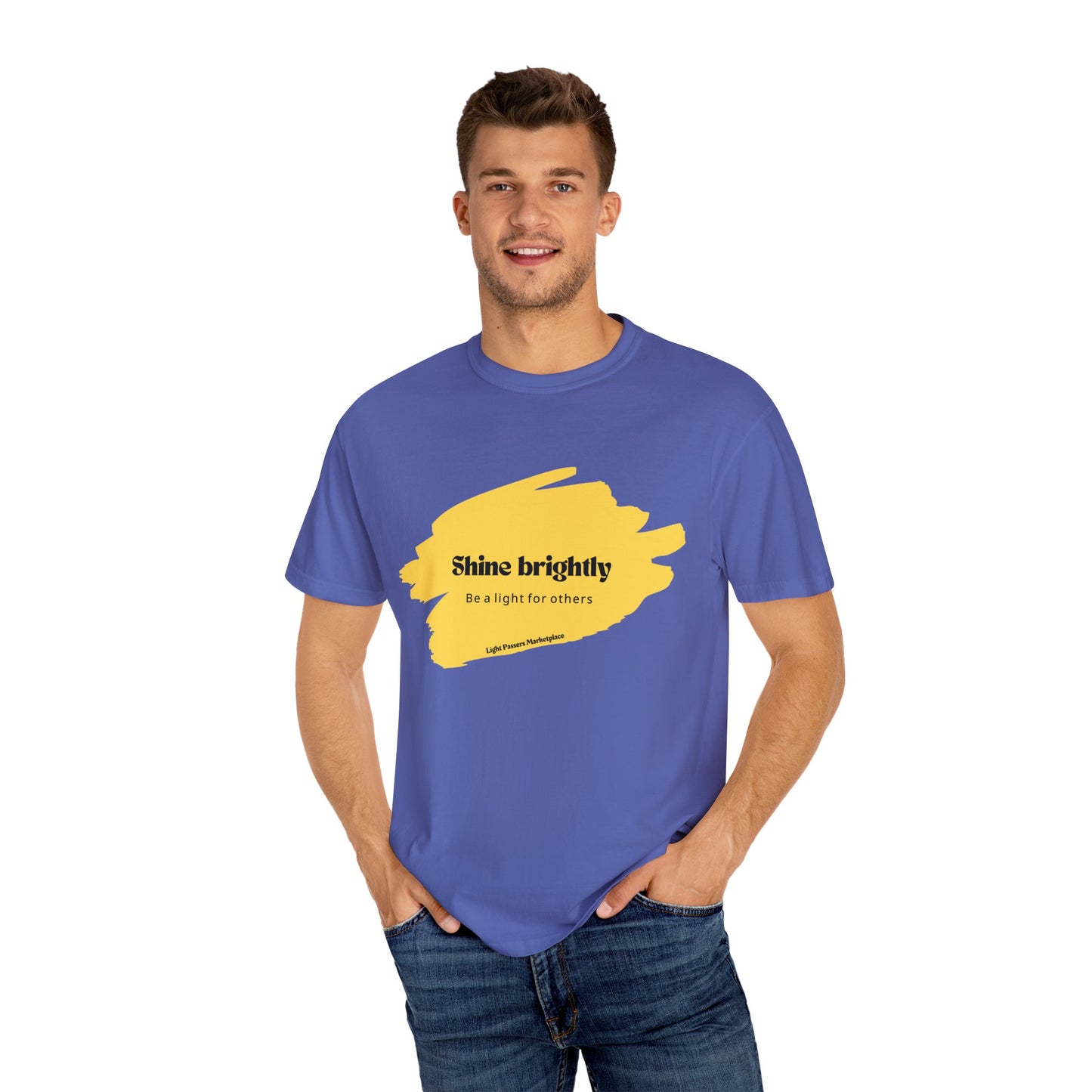 The Light Shine Brightly for Others Inspirational Design Adult Unisex T-shirt features a smiling man wearing a blue shirt with visible yellow text.
