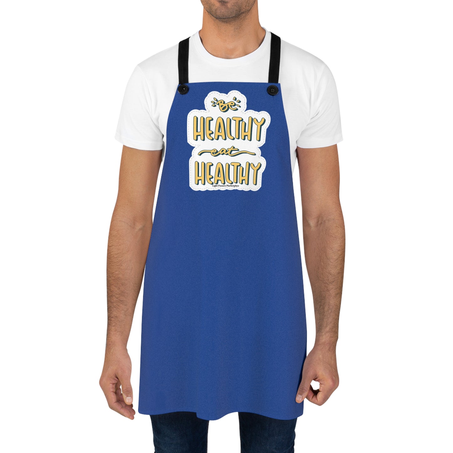 Man wearing the Be Healthy Eat Healthy apron with a comfortable fit, showcasing its durable polyester fabric and detachable black twill straps for cooking activities.