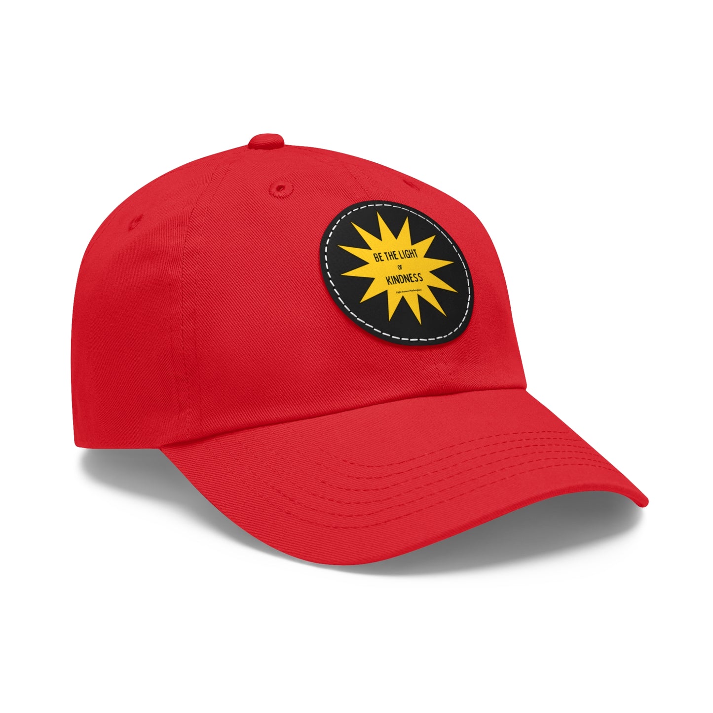 Unisex hat with 'Be the Light of Kindness' on a yellow star patch; features durable chino twill fabric and buckle closure.