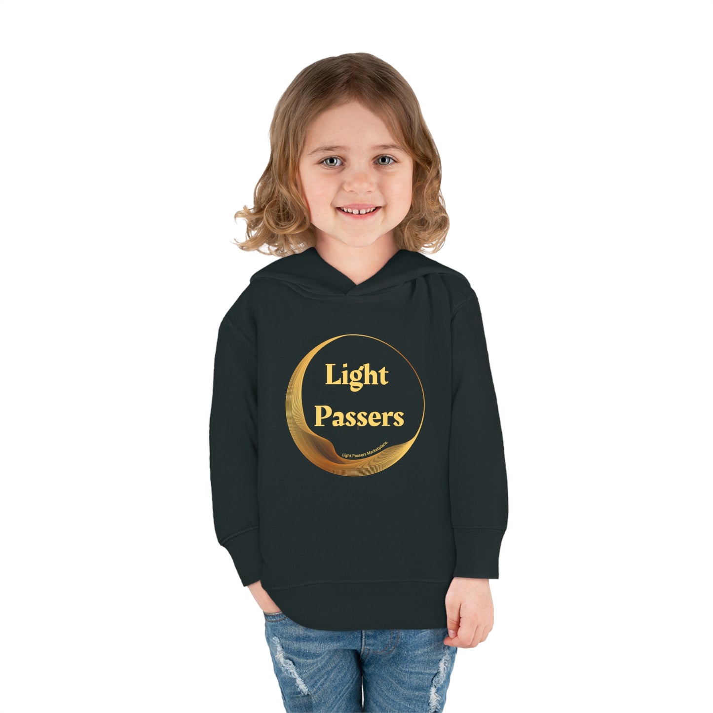 A smiling child in a black sweatshirt with a gold logo, showcasing Rabbit Skins toddler hoodie features like double-needle hem hood and side-seam pockets for comfort and durability.