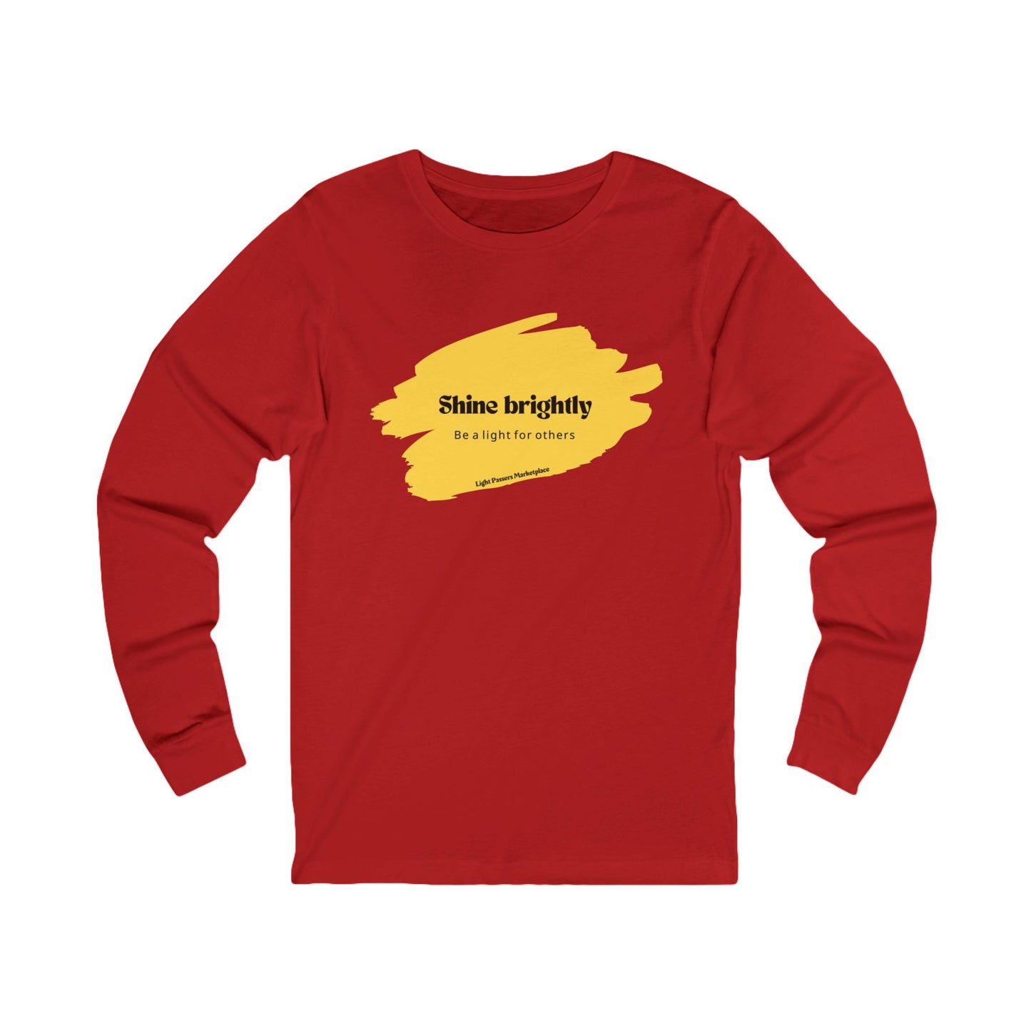 The Light Adult Unisex Long Sleeve Tee features a positive message and yellow paint accents, ideal for casual and uplifting occasions.