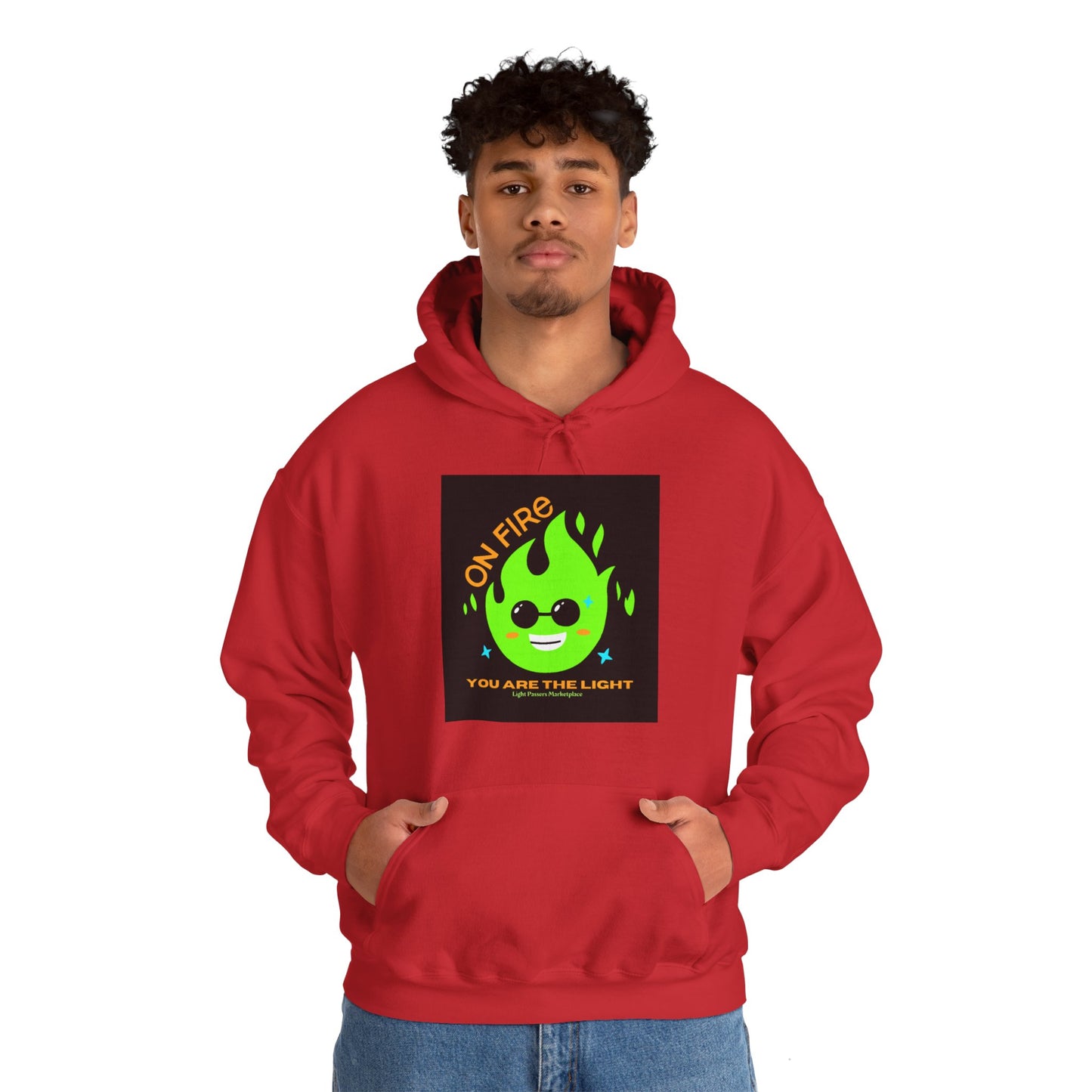 A man in a red hooded sweatshirt with a green flame design, featuring a kangaroo pocket and color-matched drawstring. Made of 50% cotton and 50% polyester for a cozy, warm feel.