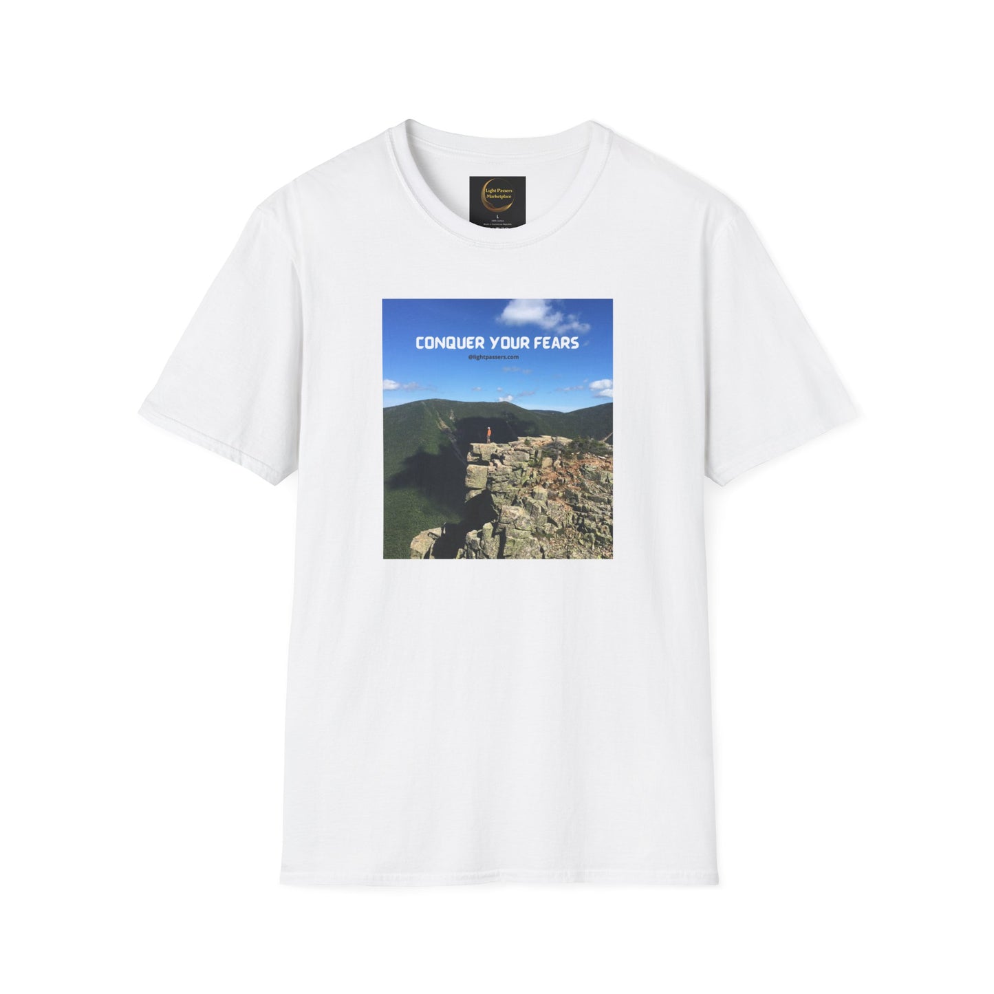 A white unisex t-shirt featuring a picture of a person conquering a cliff, symbolizing overcoming fears. Made of 100% cotton, with a classic fit and tear-away label for comfort.