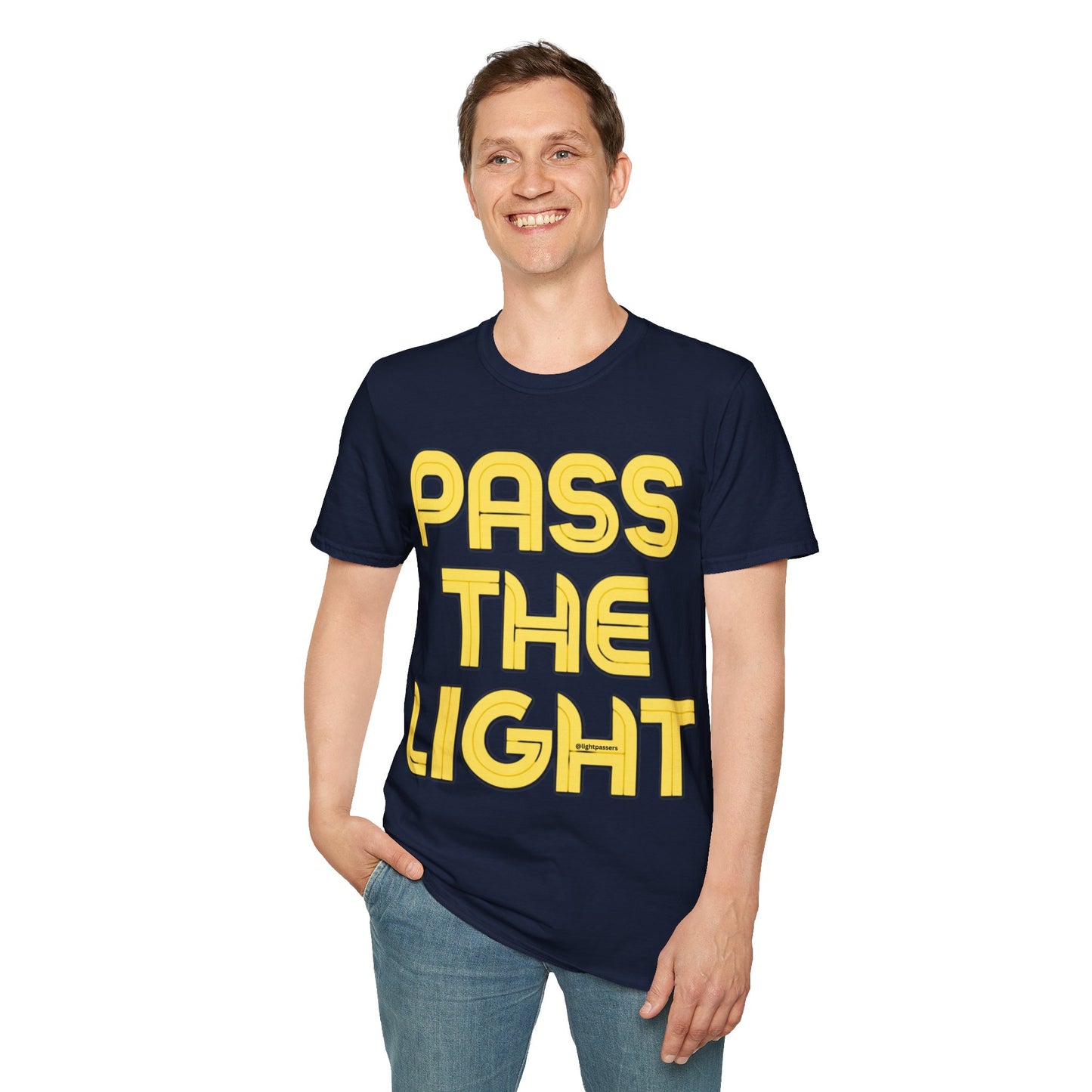 A smiling man in a PASS THE LIGHT Unisex T-shirt, featuring yellow text on a blue shirt. Classic fit, 100% cotton, no side seams, and shoulder tape for durability.