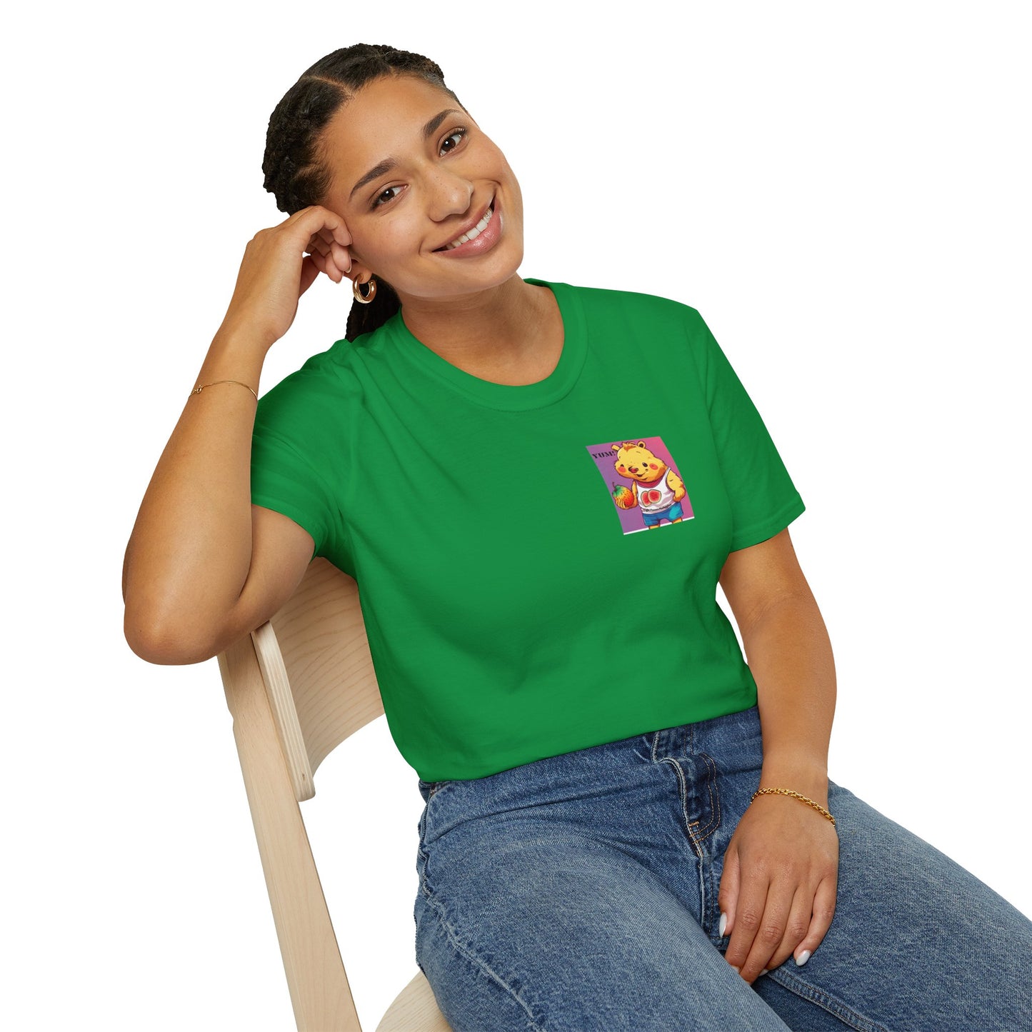 A woman in a green shirt sits on a chair, showcasing the Yum Strawberries Unisex T-Shirt. Made of soft 100% cotton, featuring twill tape shoulders for durability and a ribbed collar.