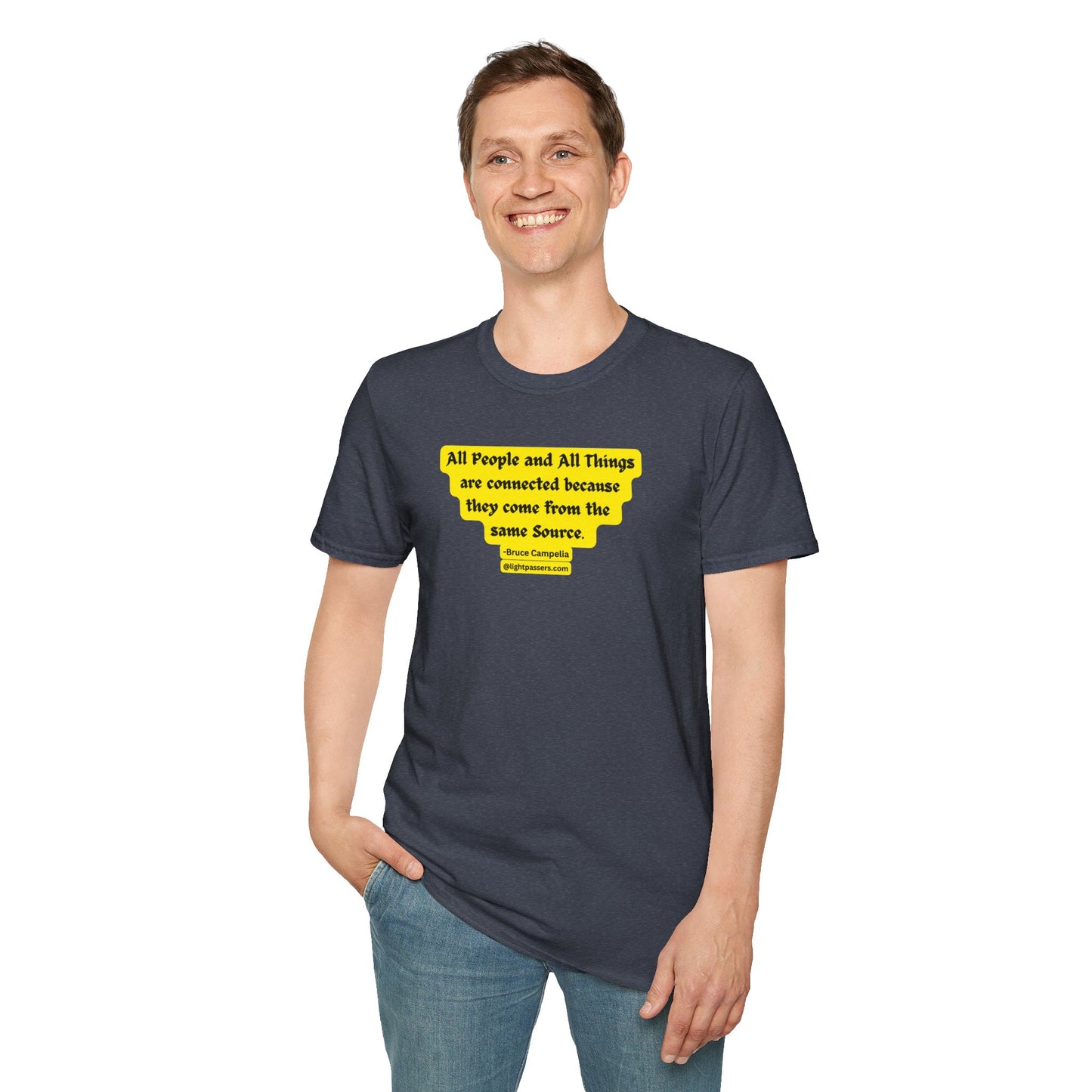 A smiling man in a yellow All People are Connected unisex T-shirt, hands in pockets. Heavy cotton tee with smooth surface for vivid printing, no side seams, tape on shoulders for durability.