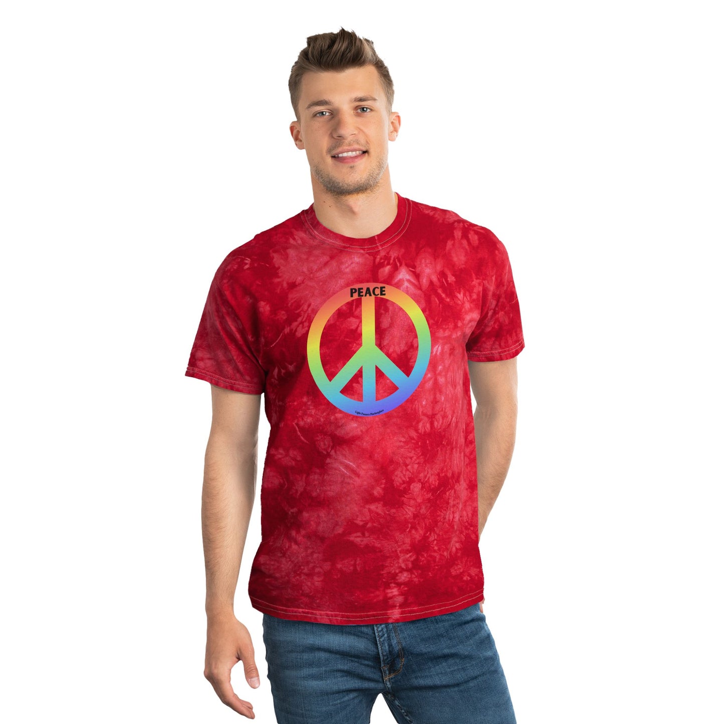 Young man models the Tie-Dye Tee Crystal Peace Sign 60s 70s Inspired T-Shirt with rainbow peace symbol and PEACE text, embodying vintage vibes from Light Passers Marketplace.