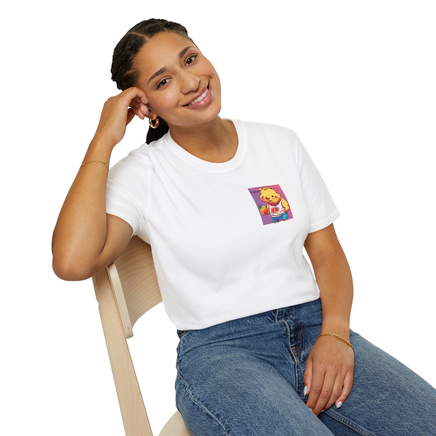 A woman in a white shirt sits on a chair, embodying comfort and style in the Yum Strawberries Unisex T-Shirt. Soft 100% cotton, ribbed collar, and tear-away label ensure year-round blissful wear.