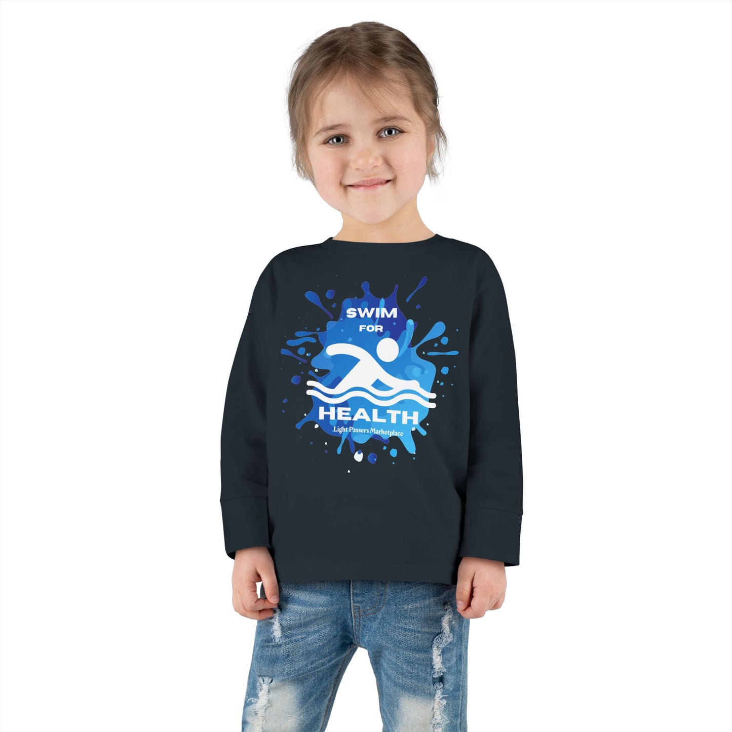 Toddler wearing the Health Toddler Long Sleeve Swim for Health tee, smiling, with visible ribbed collar and cuffs, ideal for pool or beach activities.