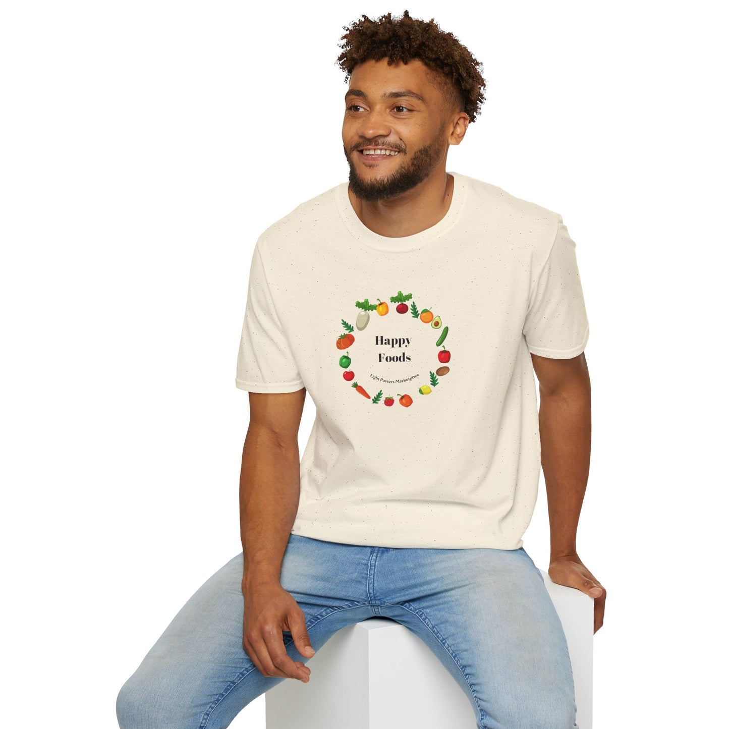 A man in a white logo shirt sits on a cube, showcasing the Happy Foods Ring Unisex T-Shirt. The tee, made of soft 100% cotton, features twill tape shoulders and a ribbed collar for durability and comfort.