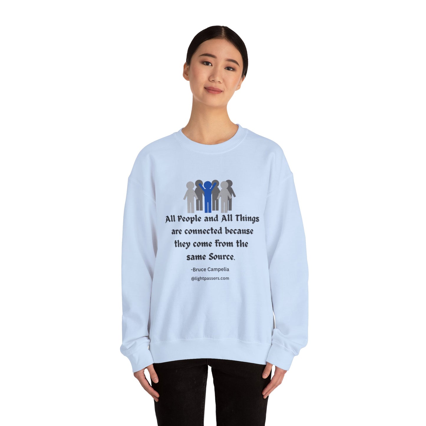 A woman in a white crewneck sweatshirt with a graphic design, showcasing comfort and durability. Made from 50% cotton and 50% polyester, featuring ribbed knit collar and double-needle stitching for lasting quality.