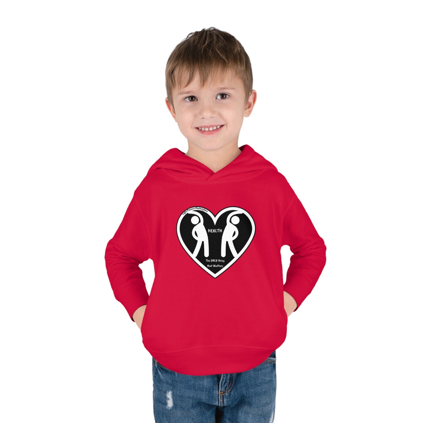 A toddler in a red hoodie with heart logo and figures, hands in pockets, close-ups of face and pants, designed for comfort and play with 60% cotton, 40% polyester blend, side-seam pockets.