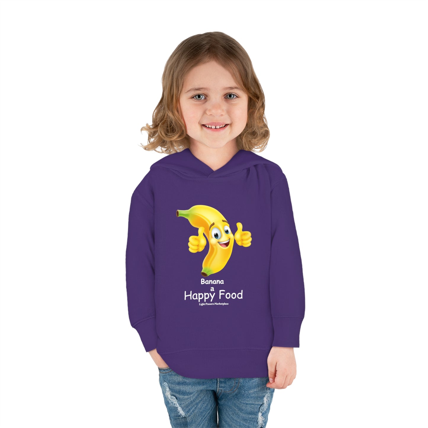 A smiling toddler in a Rabbit Skins Banana Happy Food Toddler Hooded Sweatshirt, featuring a jersey-lined hood, cover-stitched details, and side-seam pockets for cozy durability.