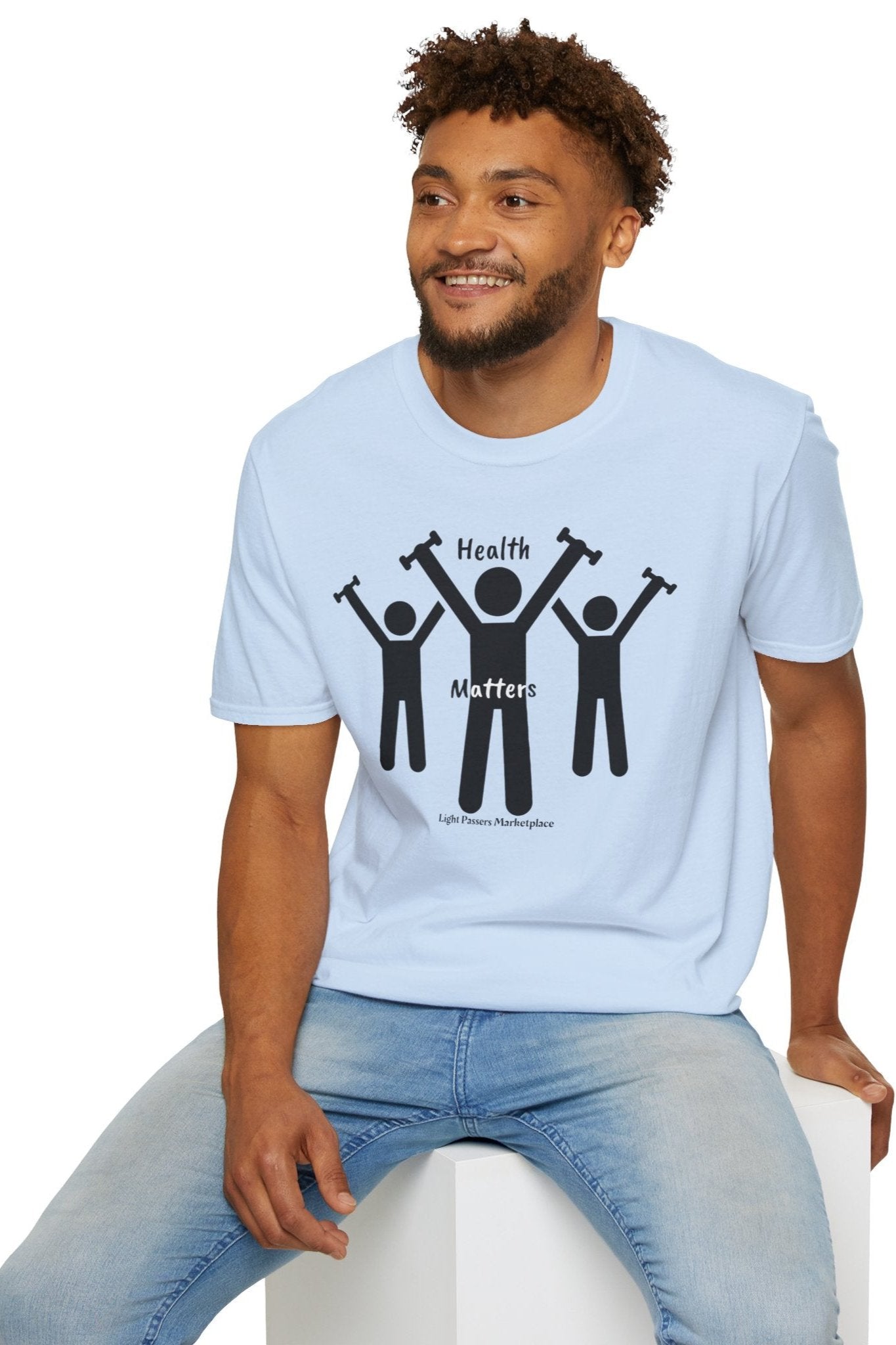 A man in a Lift Weights for Health unisex t-shirt, featuring people lifting weights graphic. Soft 100% cotton tee with twill tape shoulders, no side seams, and ribbed collar.