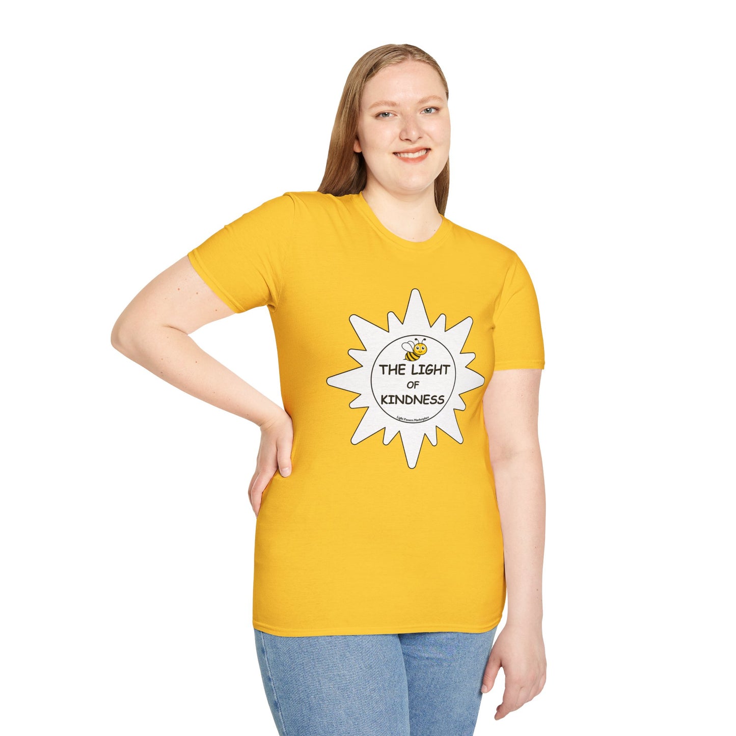 A woman in a yellow shirt with a bee design, smiling, wearing blue jeans, showcasing a unisex heavy cotton tee with smooth surface for vivid printing.