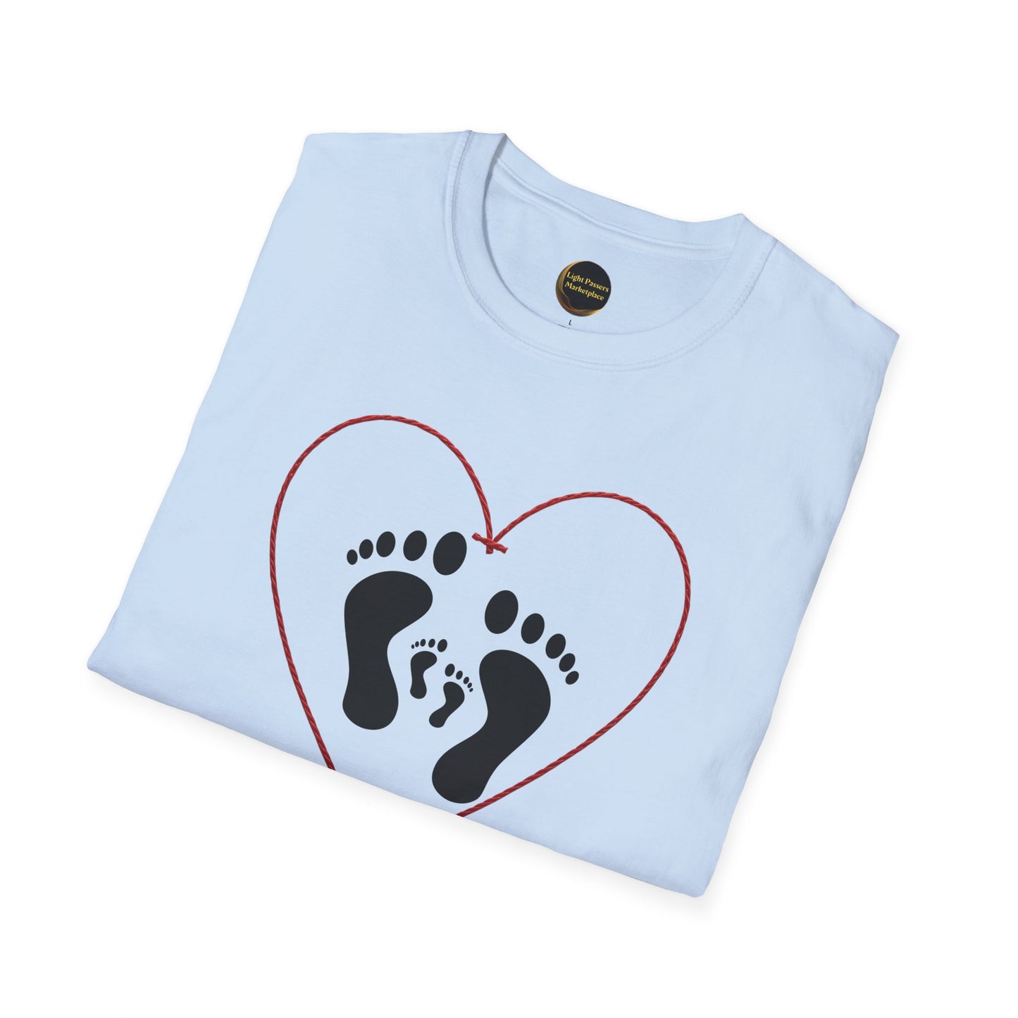 Legacy Makers Unite T-Shirt featuring adult and baby footprints inside a heart, symbolizing love and peace; folded with visible neck label.
