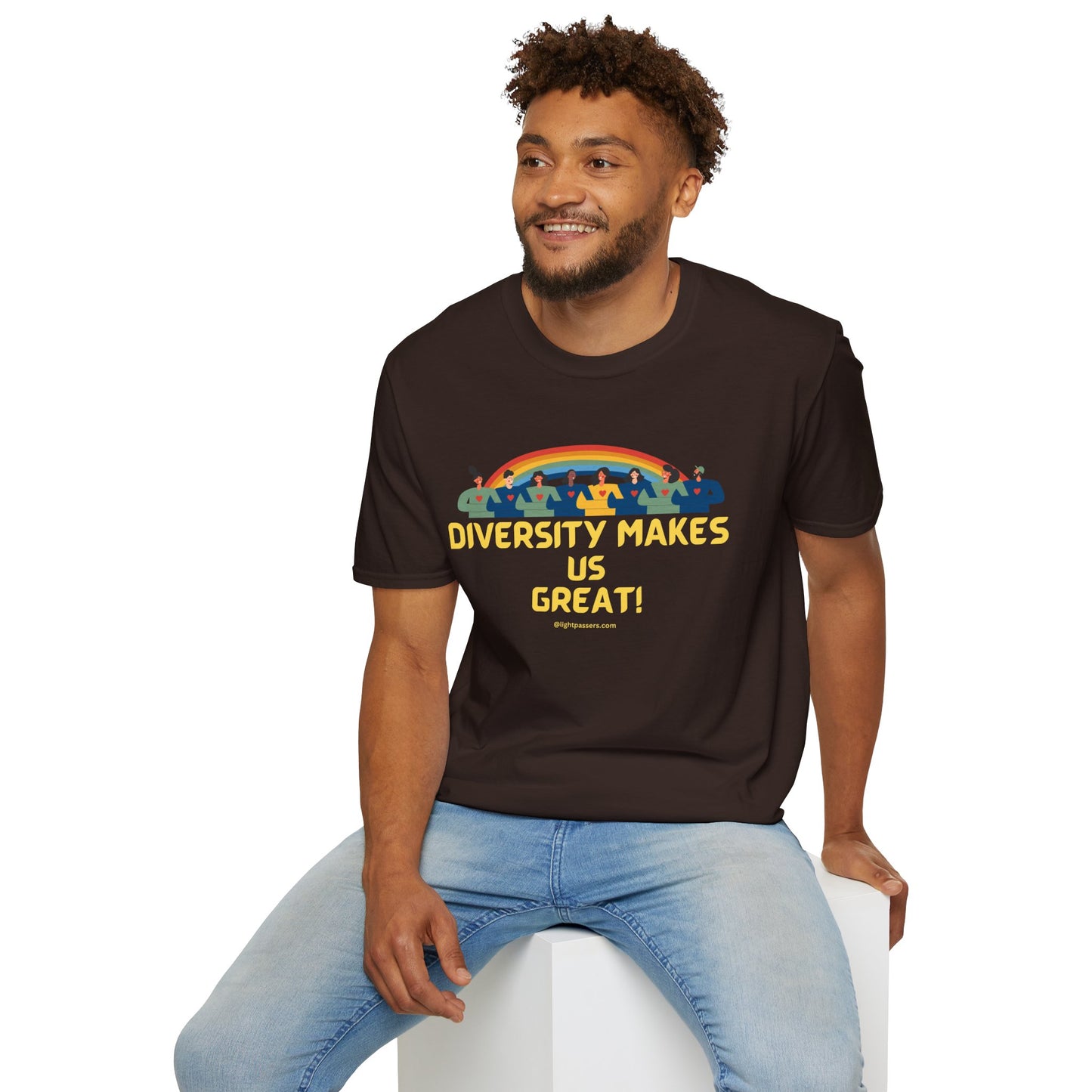 A man in a brown shirt with yellow text, sitting on a cube. Unisex heavy cotton tee with smooth surface for vivid printing, no side seams, and tape on shoulders for durability.