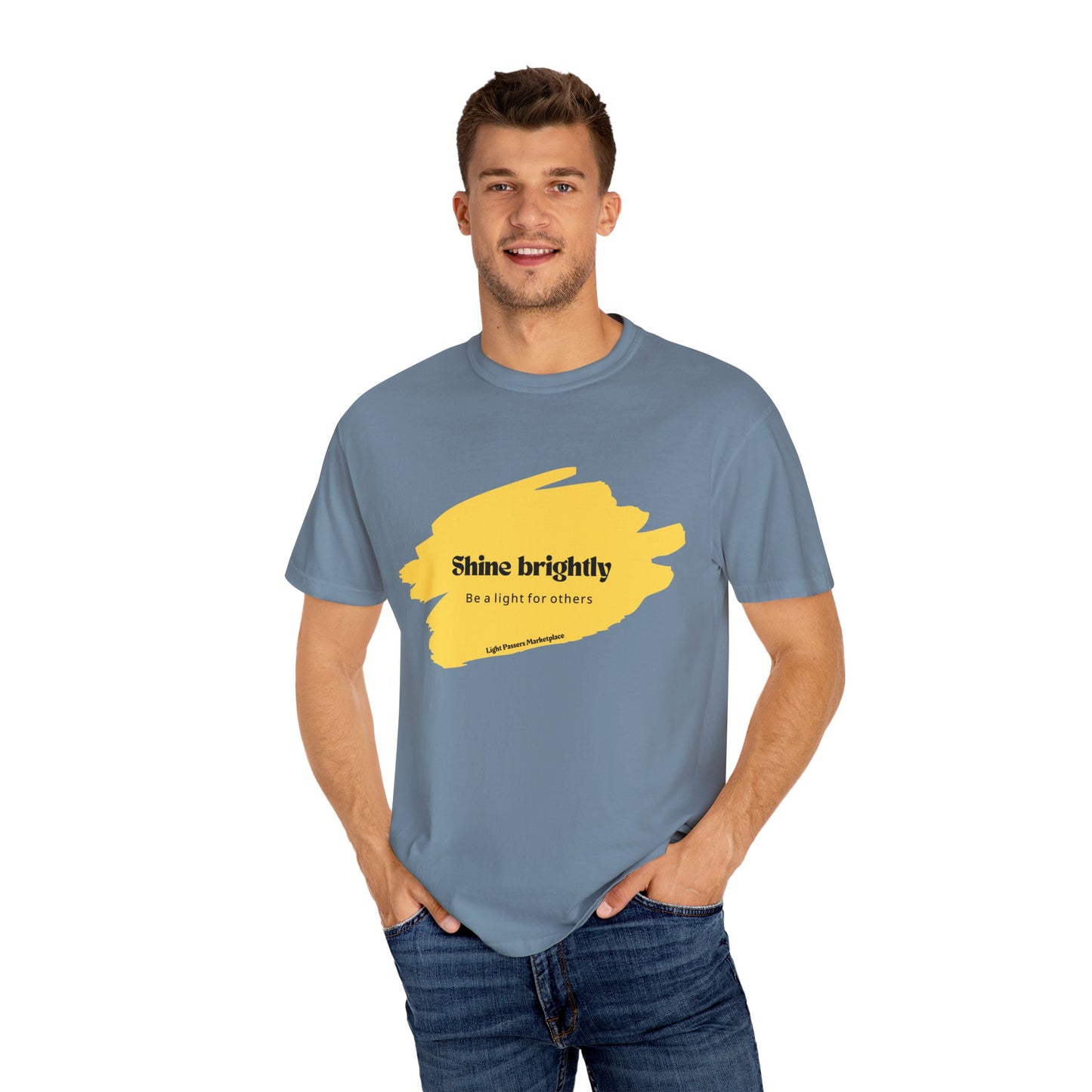 Man wearing the Light Shine Brightly for Others Inspirational Design Adult Unisex T-shirt, hands in pockets, showcasing its relaxed fit and classic crew neckline.