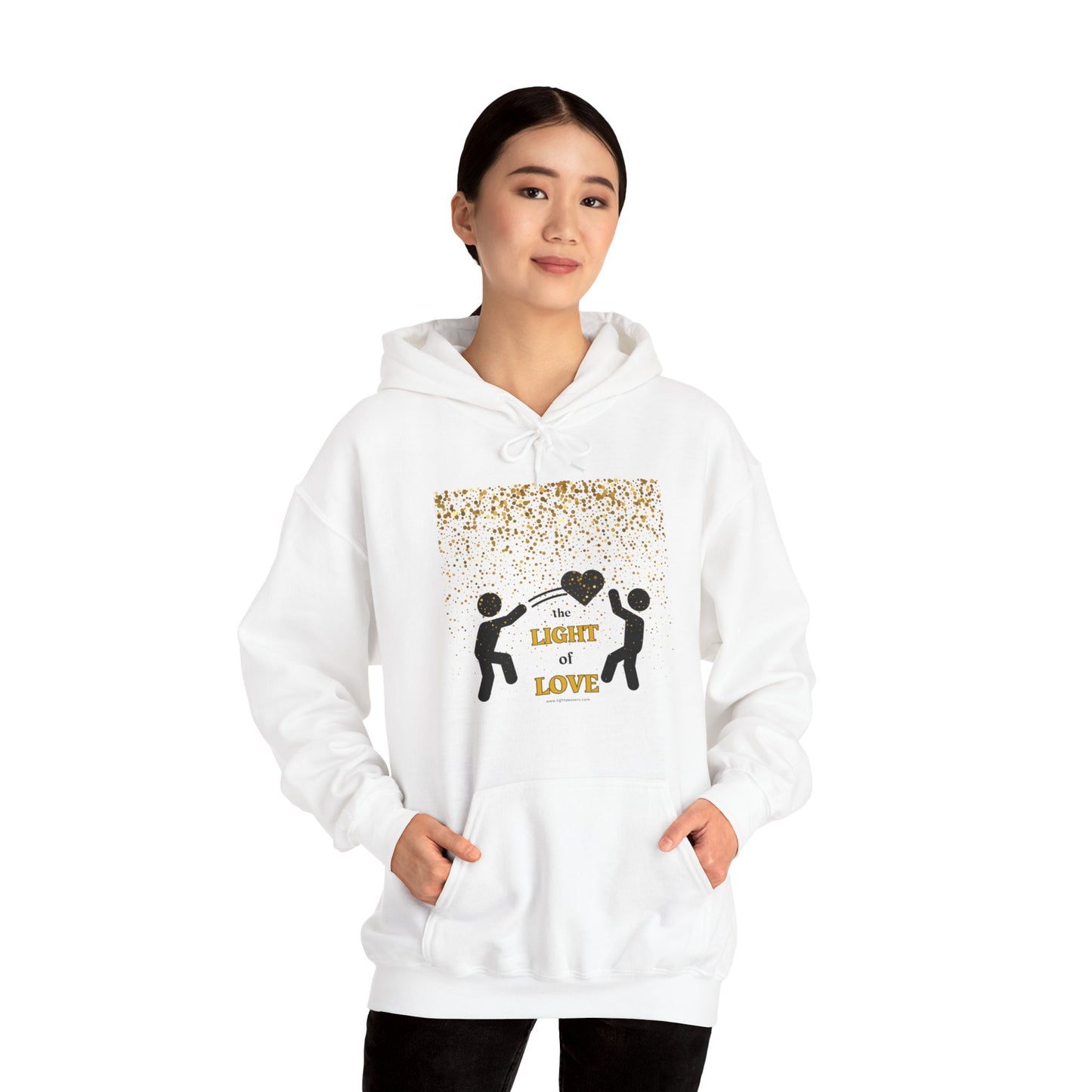 A woman in a white sweatshirt with a gold heart graphic design, showcasing a cozy unisex hooded sweatshirt made of cotton and polyester for warmth and comfort.