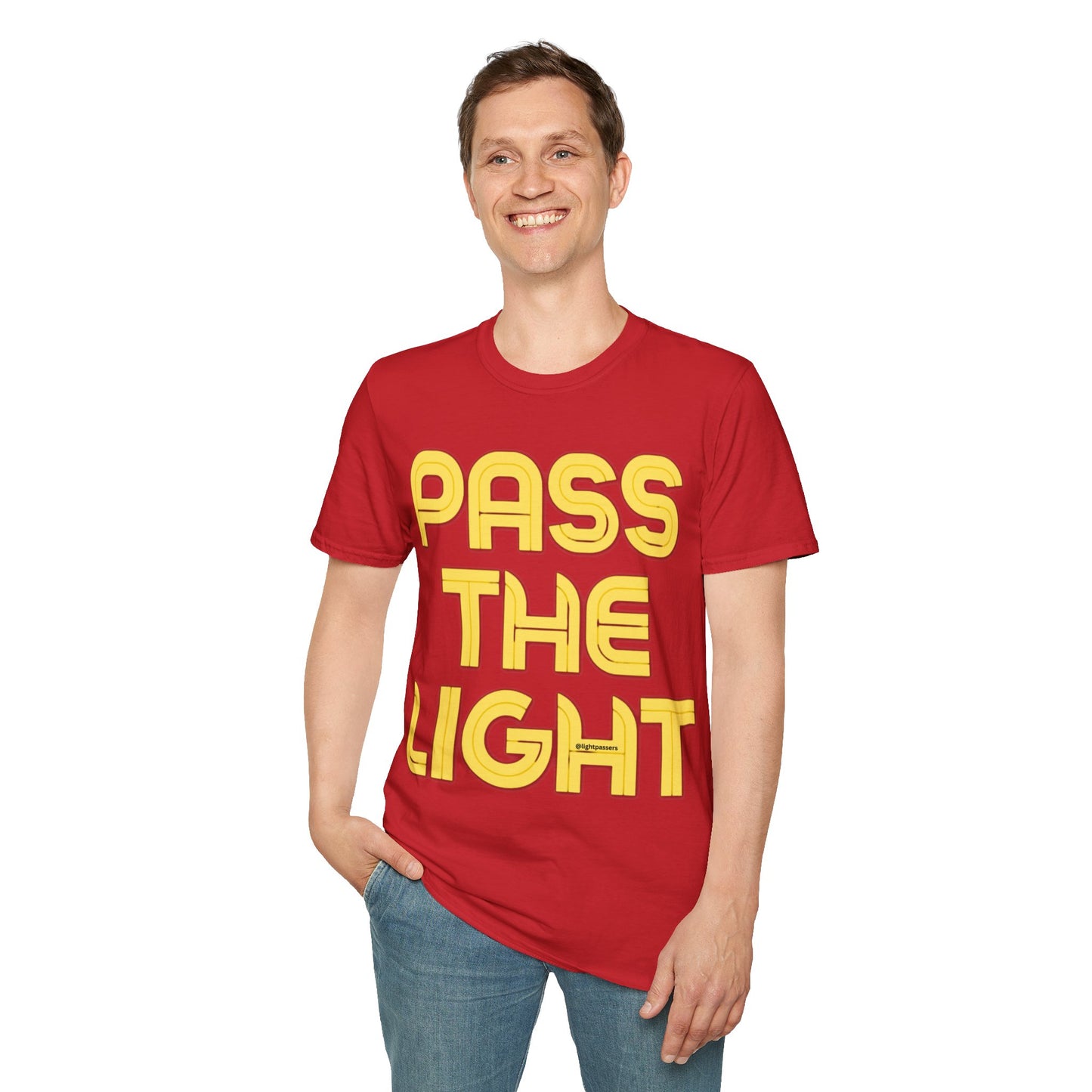 A man in a red PASS THE LIGHT unisex T-shirt, smiling. No side seams for comfort. 100% cotton, medium fabric, classic fit. Shoulder tape for durability.
