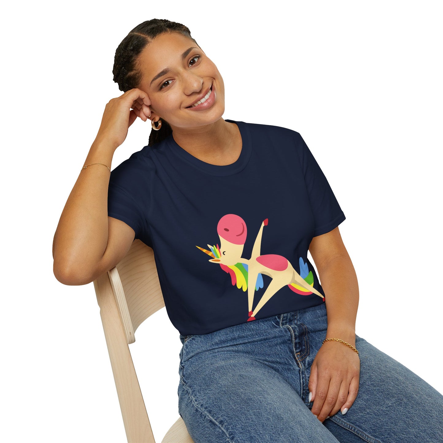 A smiling woman in a Unicorn Stretch Yoga Unisex T-Shirt, sitting on a chair. Soft 100% cotton tee with twill tape shoulders, ribbed collar, and no side seams for ultimate comfort.