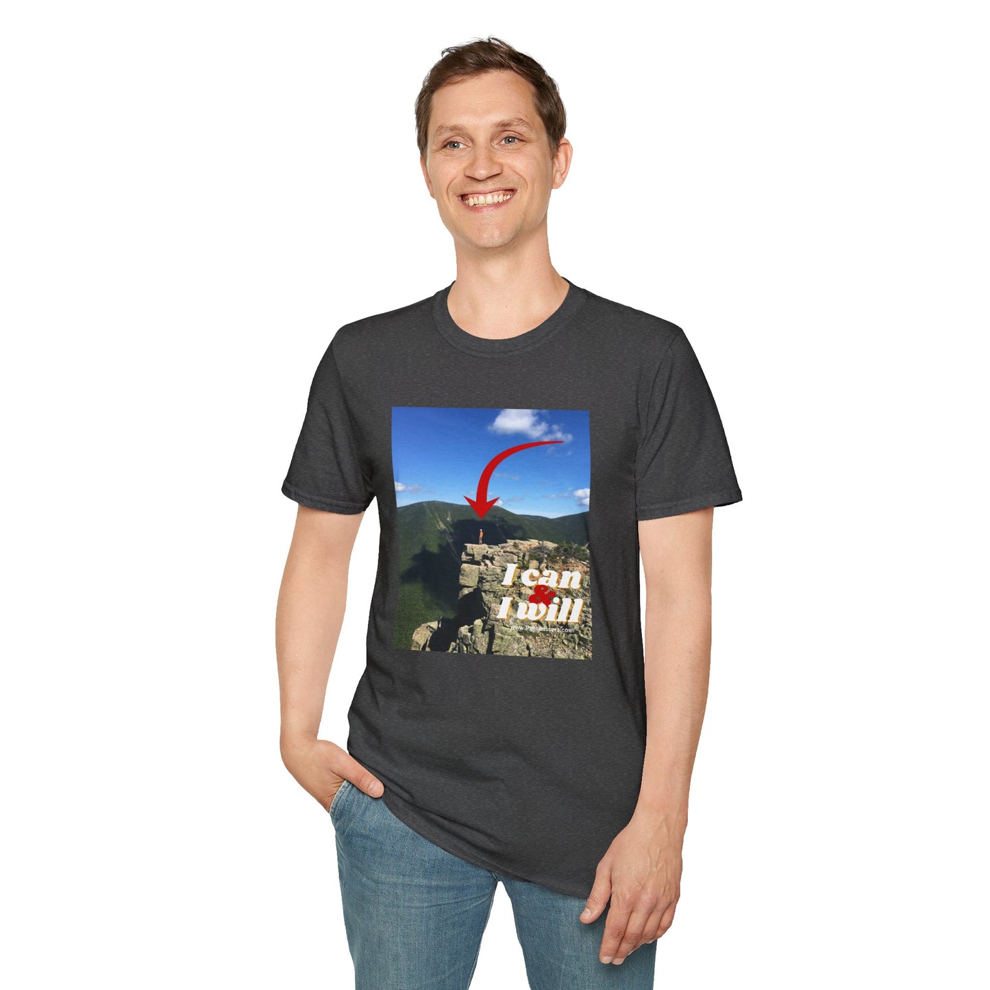 A smiling man in a Hiking I Can and I Will unisex t-shirt, standing on a cliff. Made of soft 100% cotton, featuring twill tape shoulders and a ribbed collar. Ethically produced by Gildan.