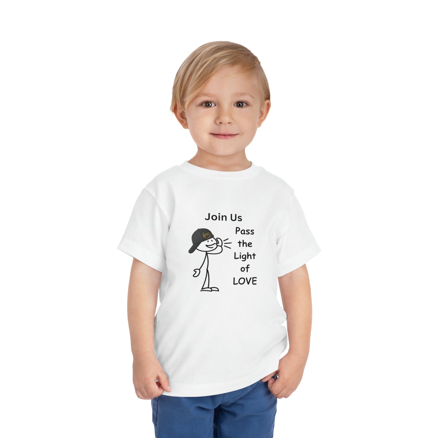 A child in a white Call Pass the Light of Love toddler t-shirt, featuring a cartoon character with a hat. Made of 100% Airlume combed cotton for comfort.