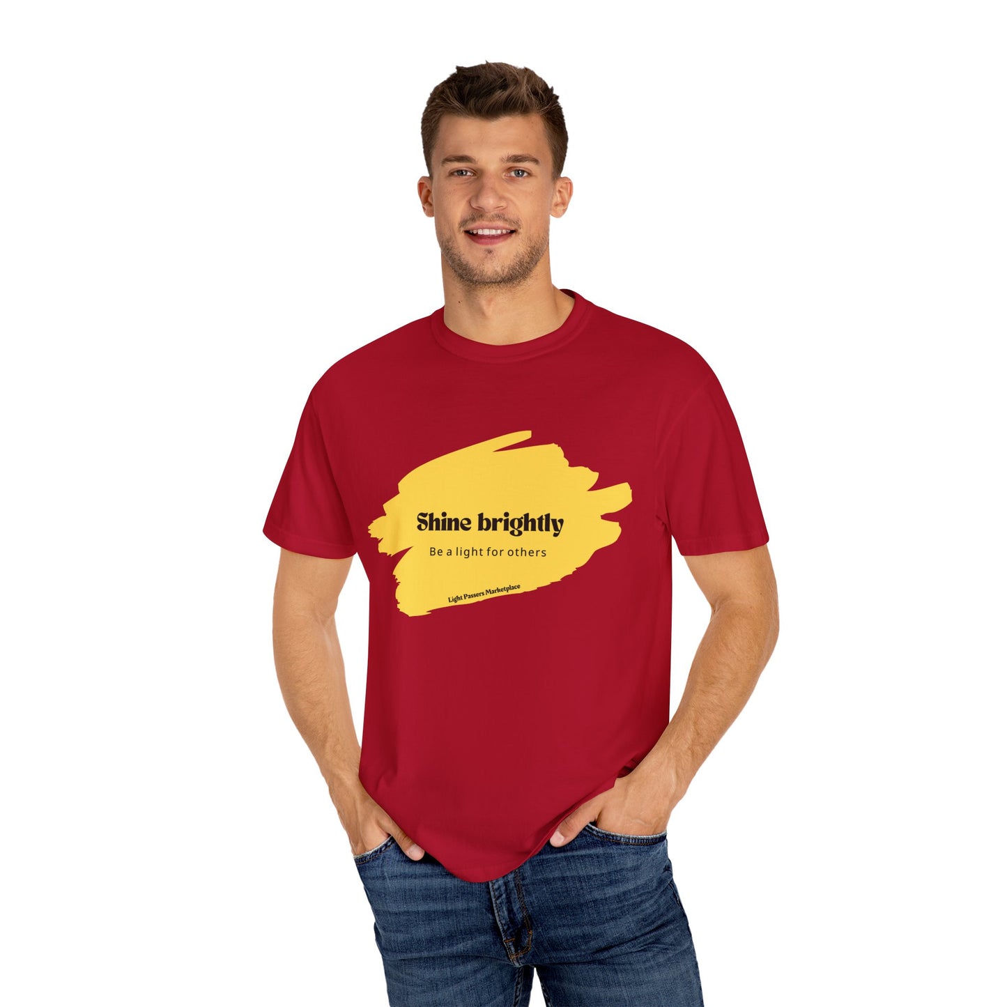 Man wearing 'Light Shine Brightly for Others' T-shirt with relaxed fit and crew neckline, highlighting casual style and inspirational message.