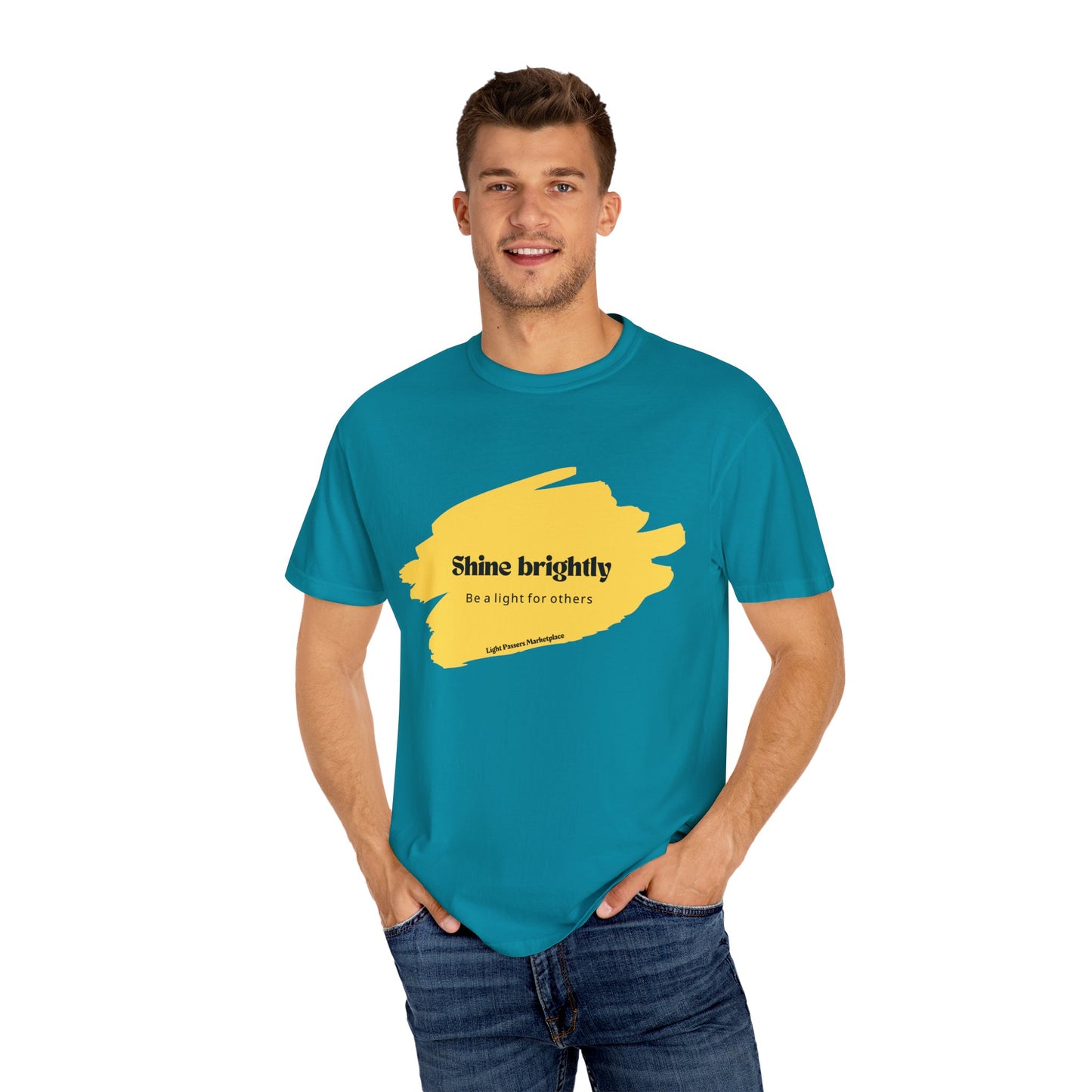 Man in blue shirt smiling, representing The Light Shine Brightly for Others Inspirational Design Adult Unisex T-shirt, highlighting casual, relaxed fit and classic crew neckline.