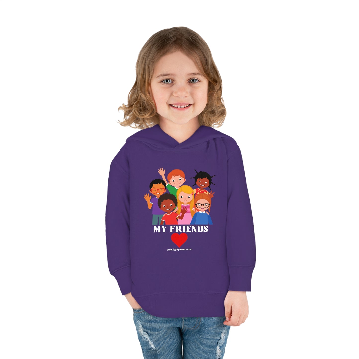 A toddler in a purple sweatshirt with cartoon characters, smiling. Rabbit Skins My Friends Toddler Hoodie: Combed cotton blend, jersey-lined hood, cover-stitched details, side pockets for cozy wear.