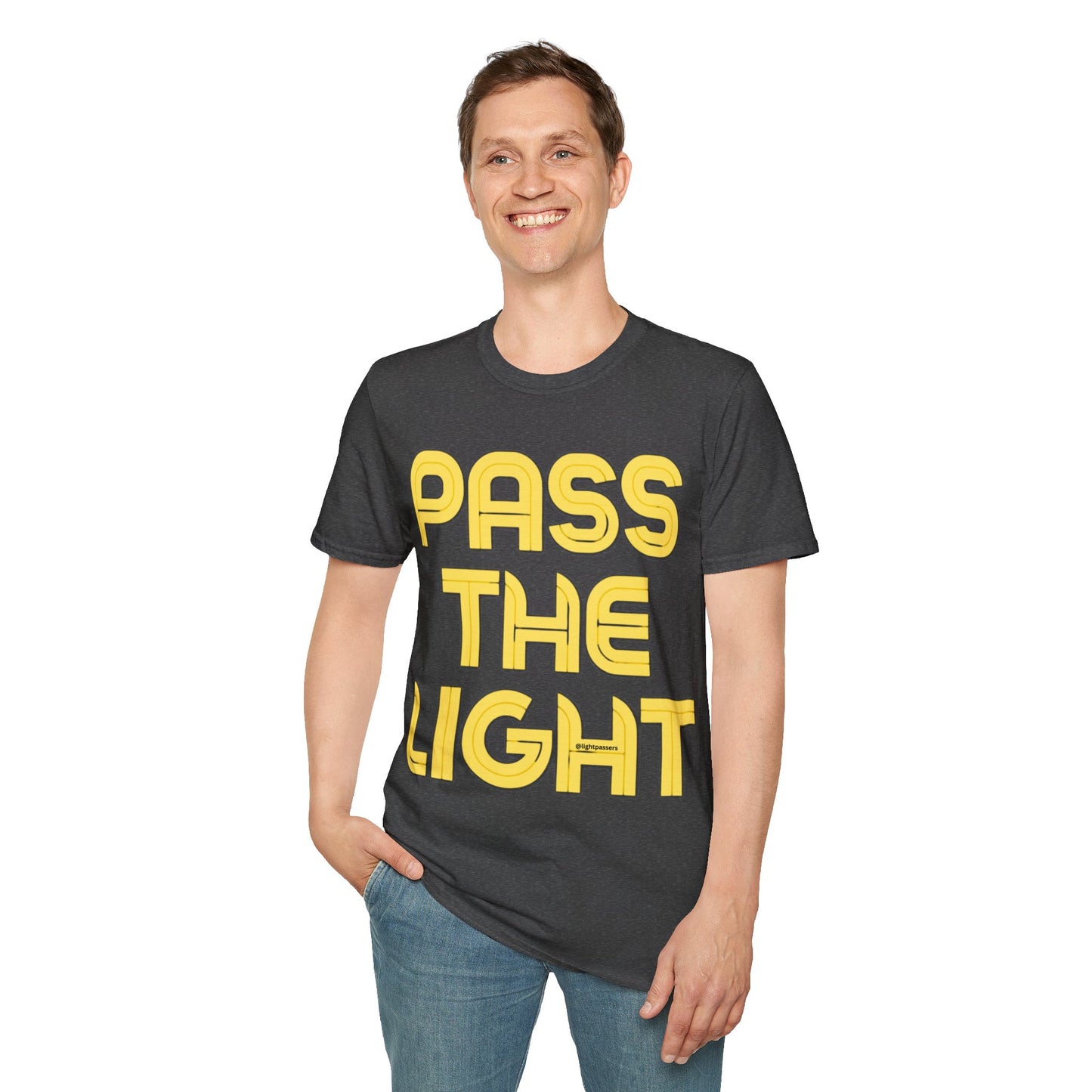 A man smiling in a PASS THE LIGHT Unisex T-shirt with yellow text. Black shirt, no side seams, tape on shoulders for durability. 100% cotton, medium fabric, classic fit.