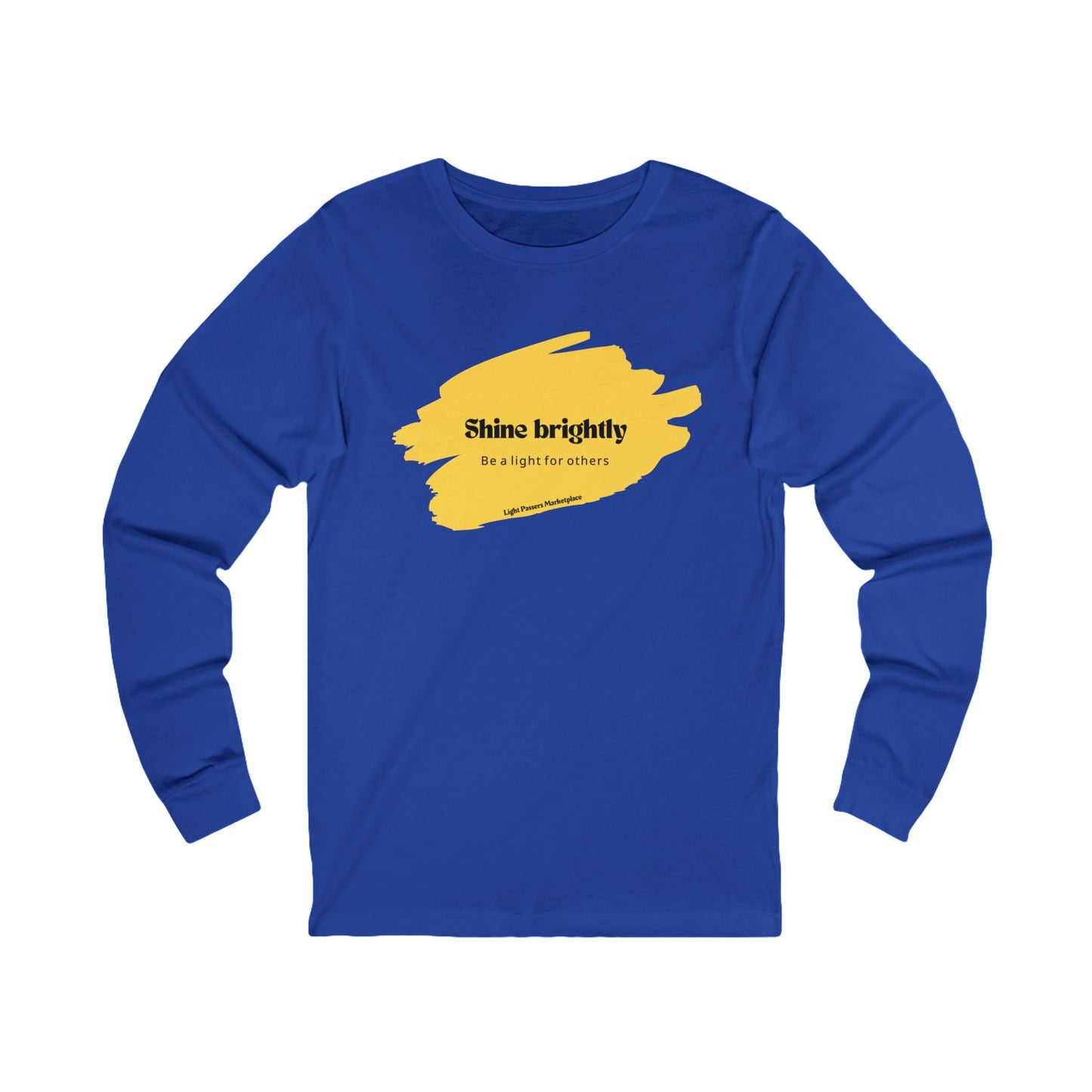 The Light Adult Unisex Long Sleeve Tee features yellow paint splatters, promoting positivity with Shine Brightly Be the Light for Others message.