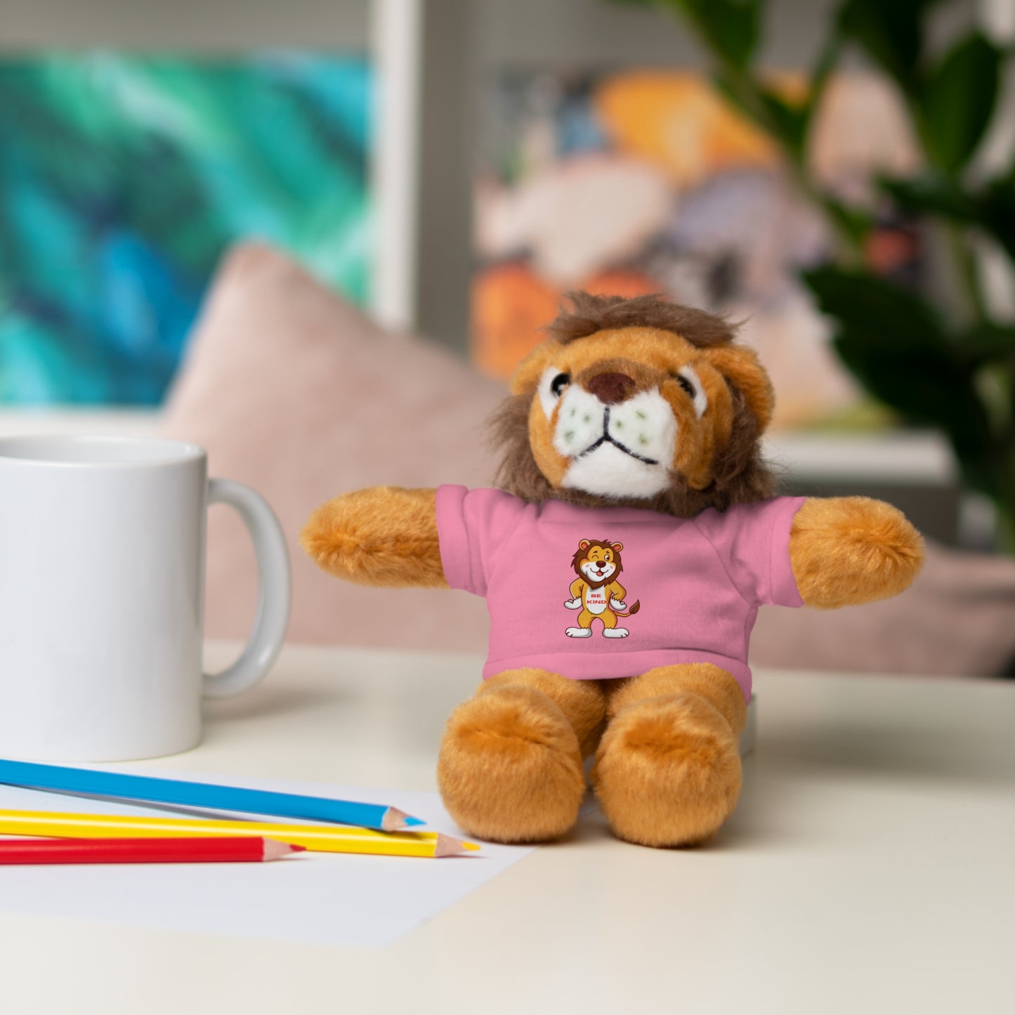 Be Kind Lion Stuffed Animal with shirt; an 8 plush toy featuring a cartoon lion wearing a removable tee, ideal for children aged 3 and up.