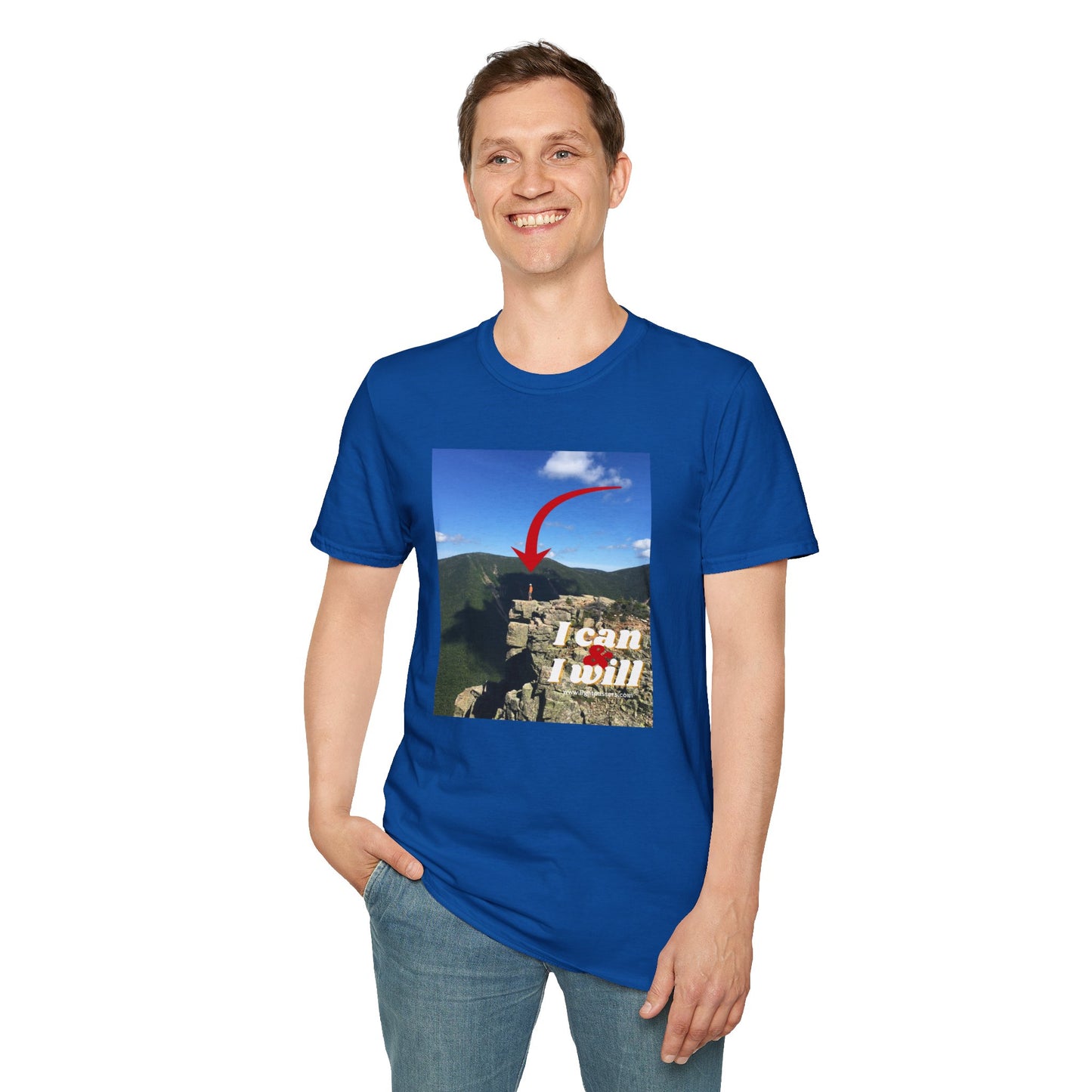 A man in a blue shirt standing confidently on a cliff, embodying the spirit of Hiking I Can and I Will unisex t-shirt. Made of soft, durable cotton with a classic fit and tear-away label for comfort.