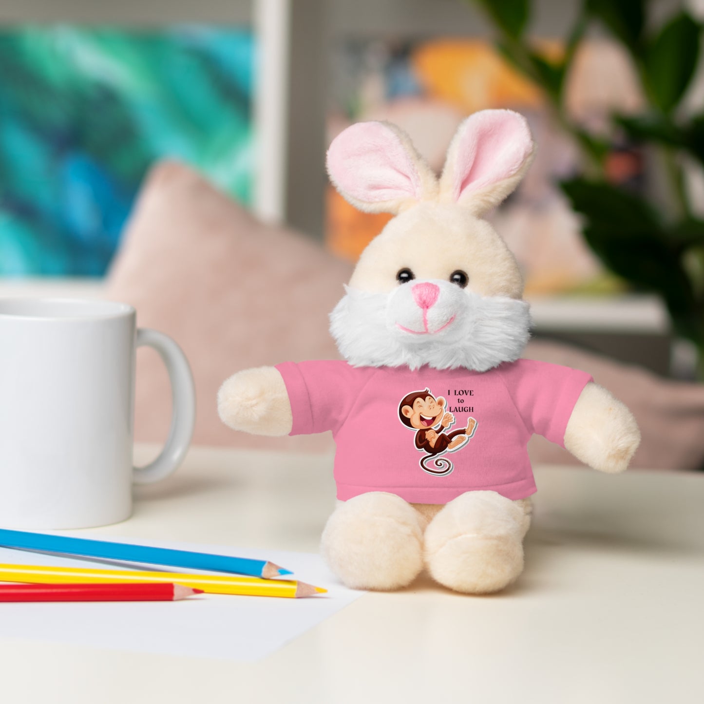 Cool Stuff Stuffies plush toy, Bunny with removable 'I Love to Laugh' T-shirt, ideal for kids' playtime and cuddling.