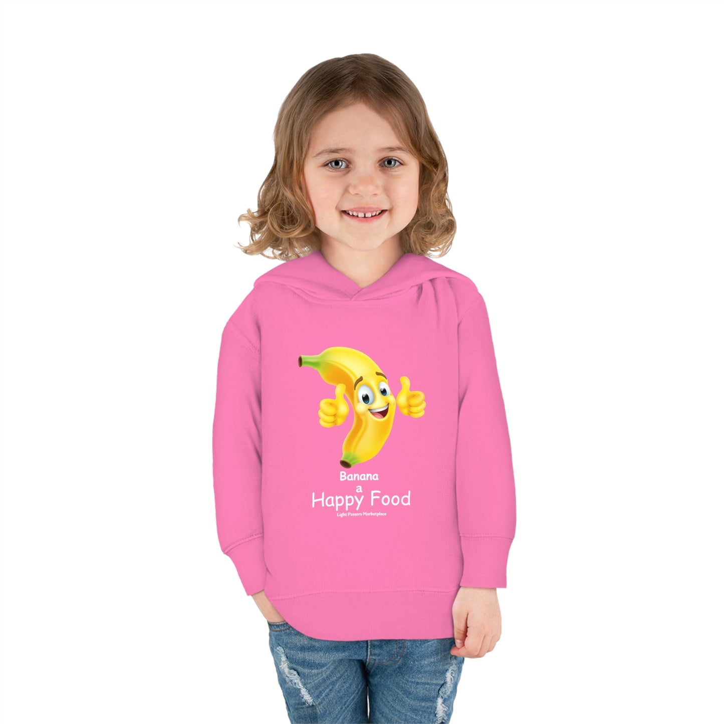 A toddler in a pink Rabbit Skins hoodie with a cartoon banana design giving a thumbs up. Features jersey-lined hood, cover-stitched details, and side seam pockets for lasting coziness.