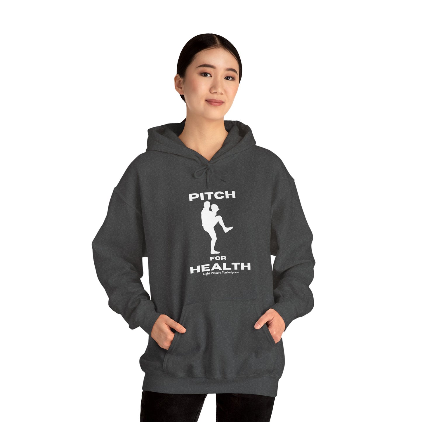 A woman in a grey hooded sweatshirt with a baseball player design, showcasing the cozy blend of cotton and polyester for warmth and comfort. Kangaroo pocket and color-matched drawstring add style and practicality.