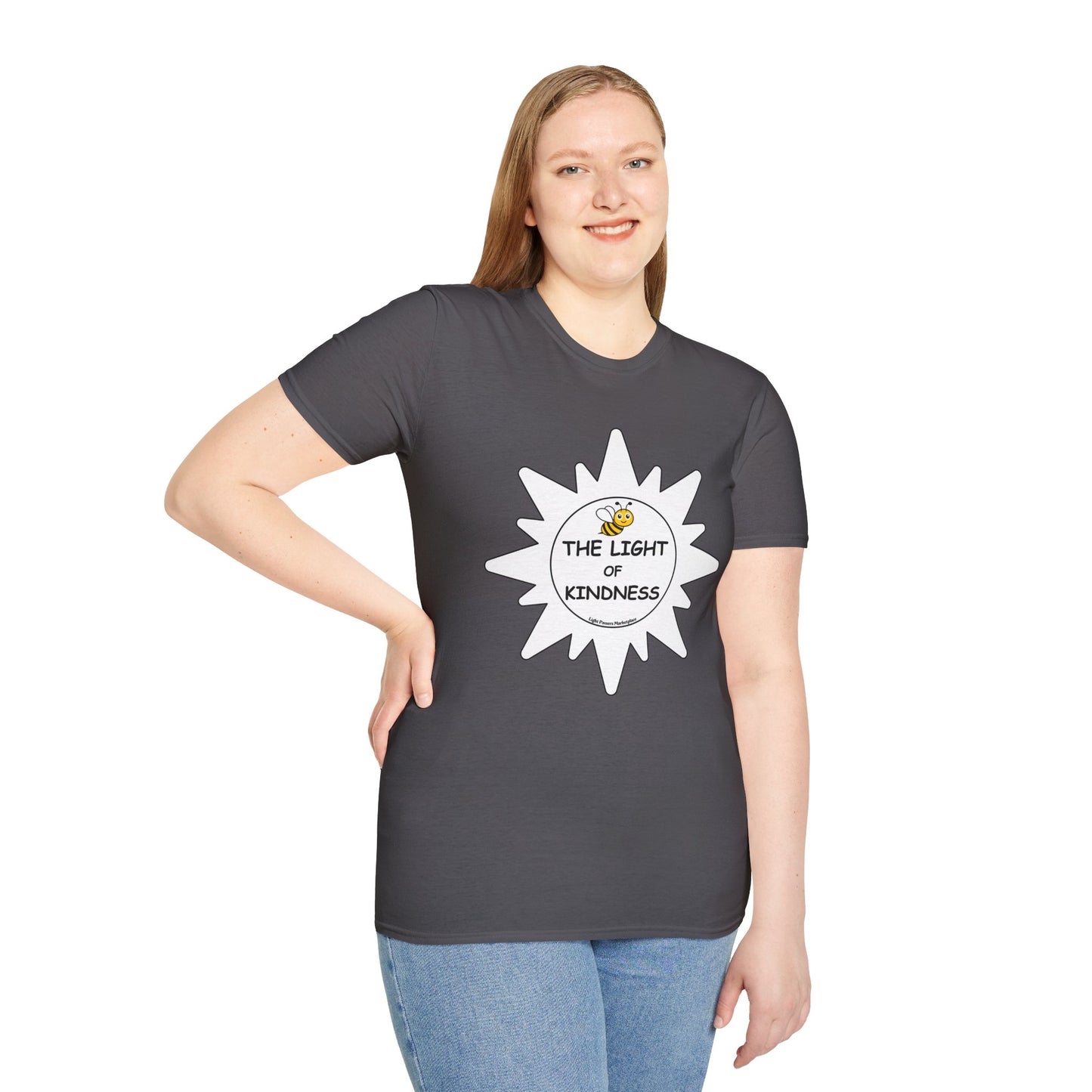 A woman in a grey shirt with a white sun logo poses, showcasing the BEE the Light of Kindness white star Unisex T-shirt. Classic fit, 100% cotton, no side seams for comfort.