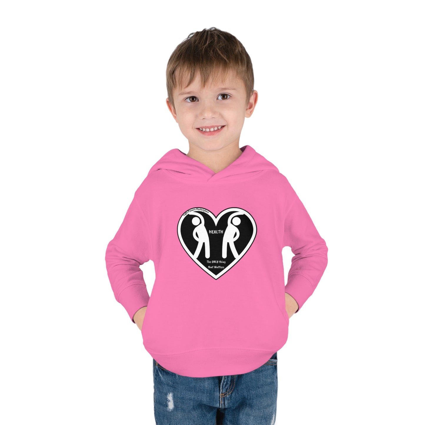 A toddler in a pink hoodie with heart figures, hands in pockets, and close-ups of face, pants, and hair. Designed for play with 60% cotton, 40% polyester, side-seam pockets, and EasyTear™ label.