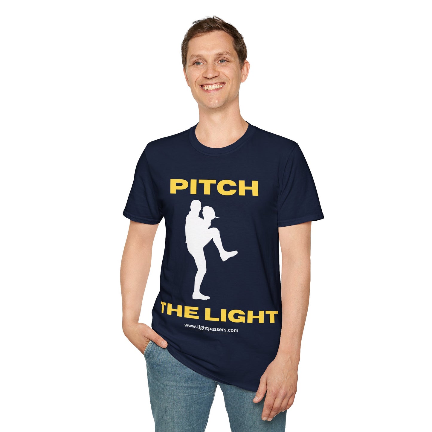 A man in a blue shirt smiles, wearing a PITCH THE LIGHT yellow lettering unisex t-shirt with a baseball player graphic. Soft 100% cotton tee with twill tape shoulders and ribbed collar.